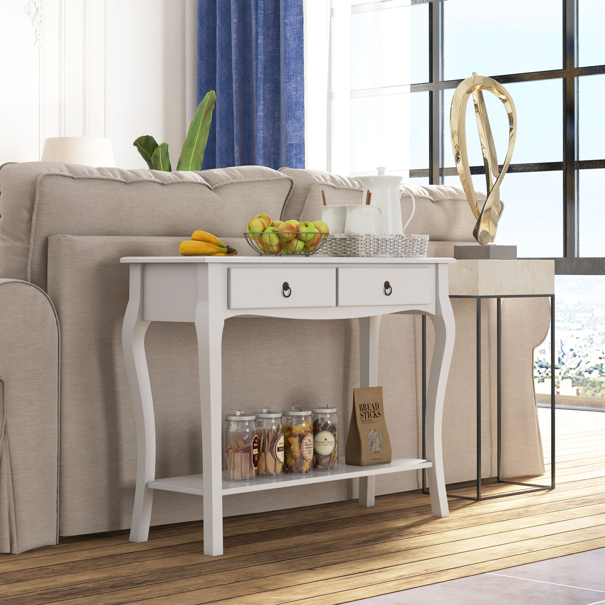 Un tavolino bianco con un design curvo. Ha due cassetti, un ripiano inferiore e vari oggetti sopra.