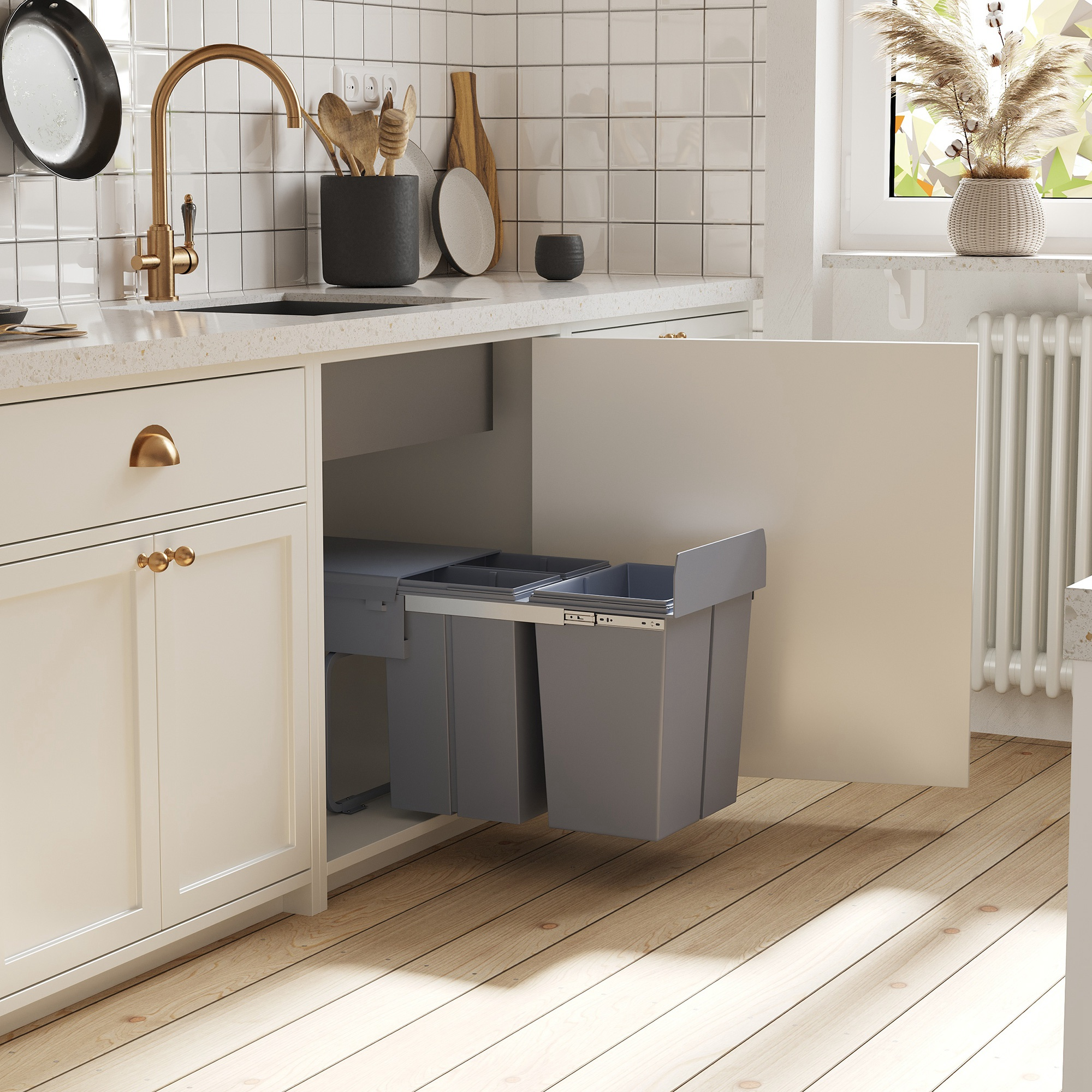 Mobile da cucina con bidoni della spazzatura grigi estraibili sotto un piano di lavoro bianco.