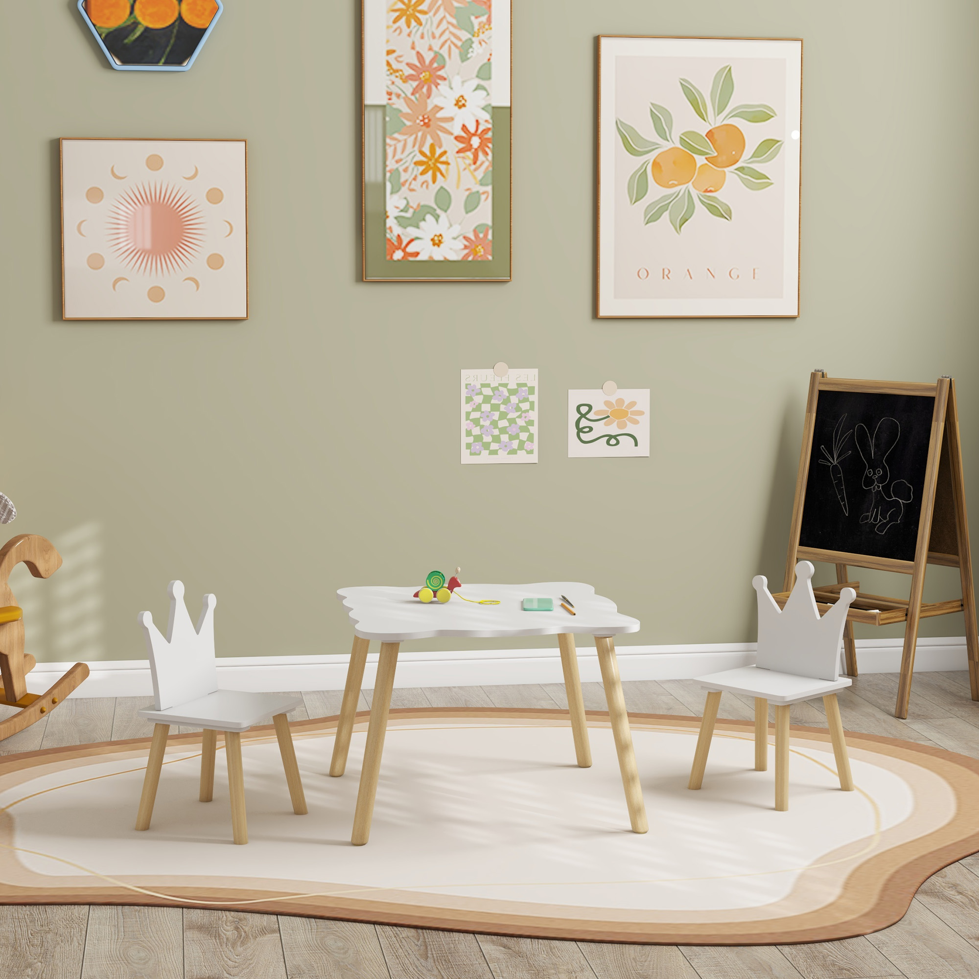 Stanza per bambini con tavolo, due sedie e arte murale con tappeto.