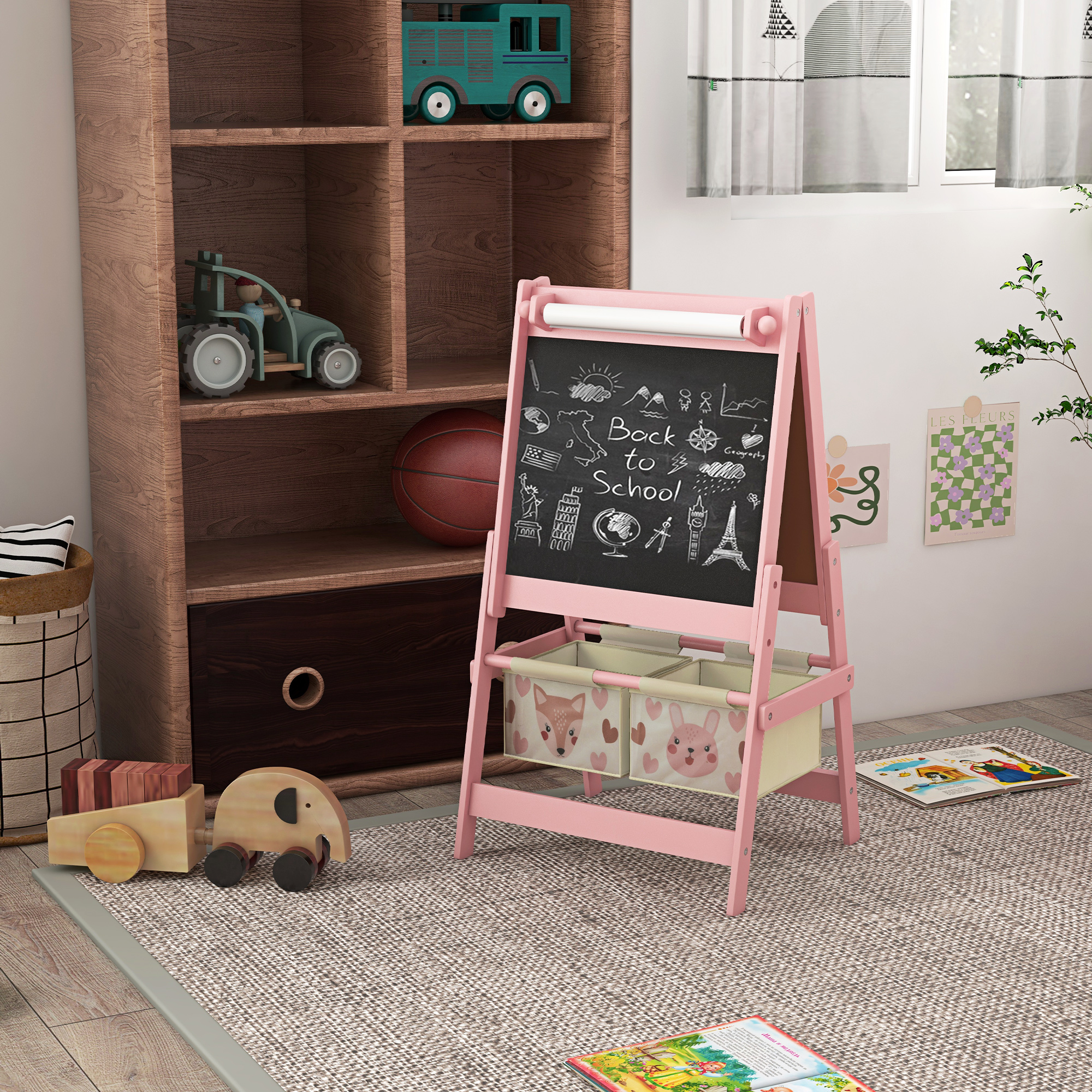 Cavalletto rosa per bambini con disegni e contenitori, in una stanza.