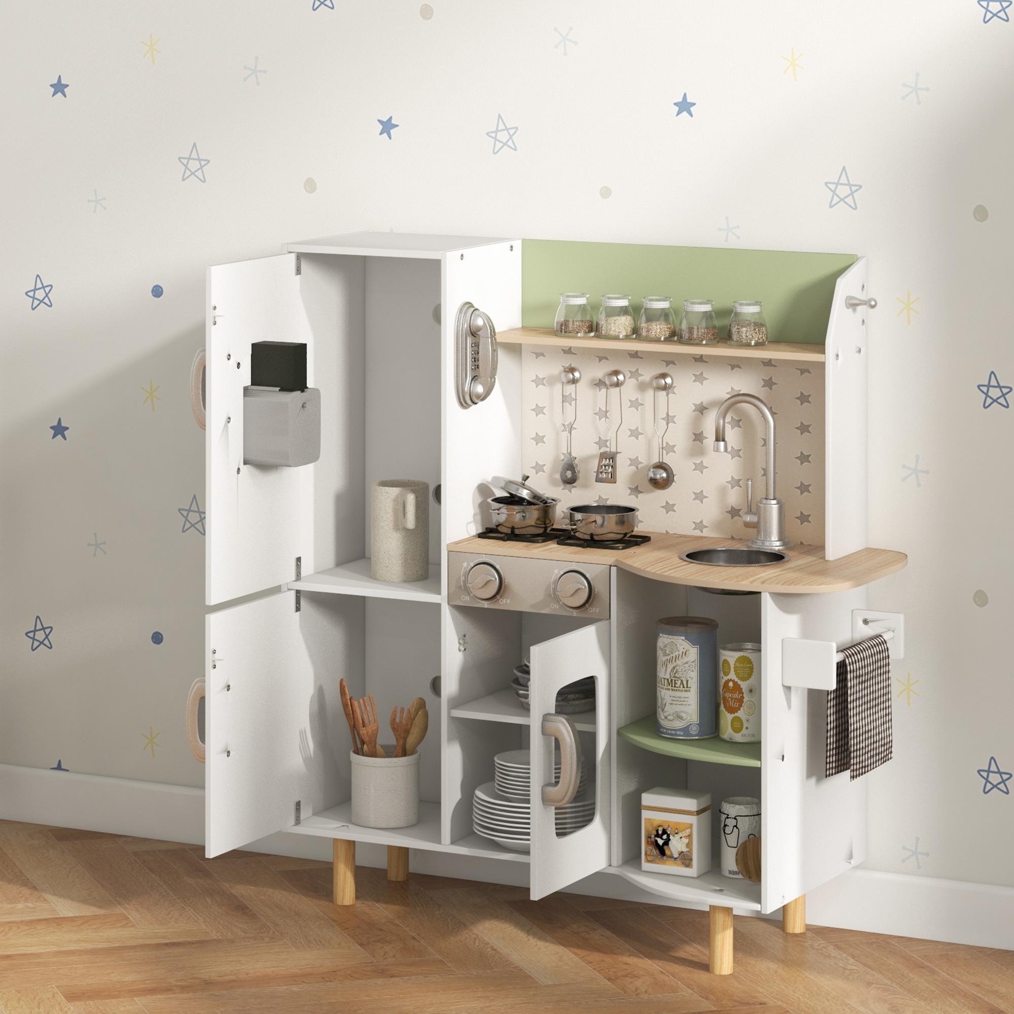 Cucina bianca per bambini con vari utensili da cucina e decorazioni. Lo sfondo è un motivo a stelle.