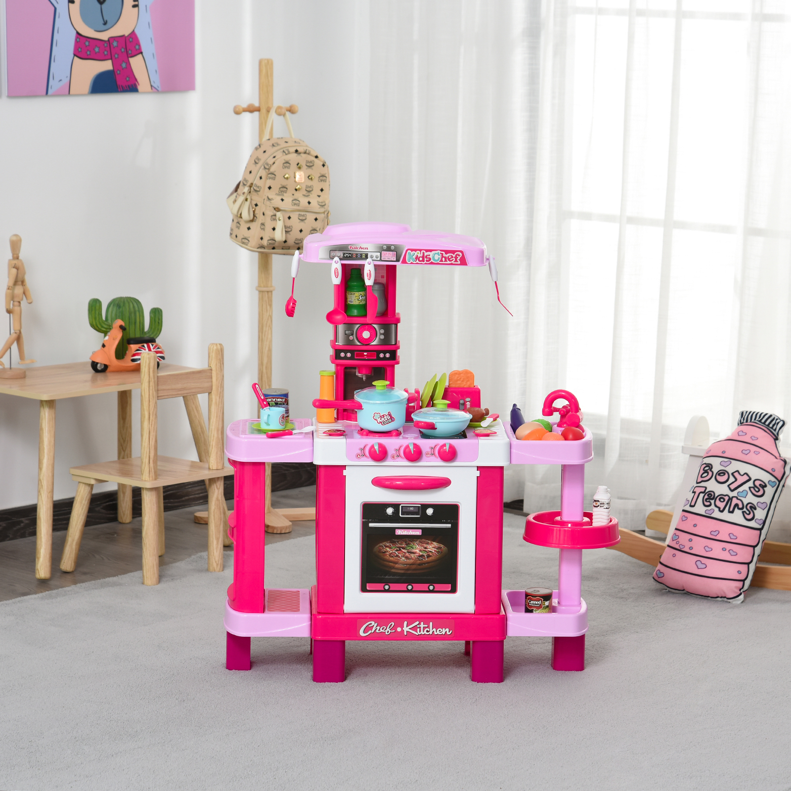 Set cucina per bambini rosa e bianco con cibo giocattolo e accessori.