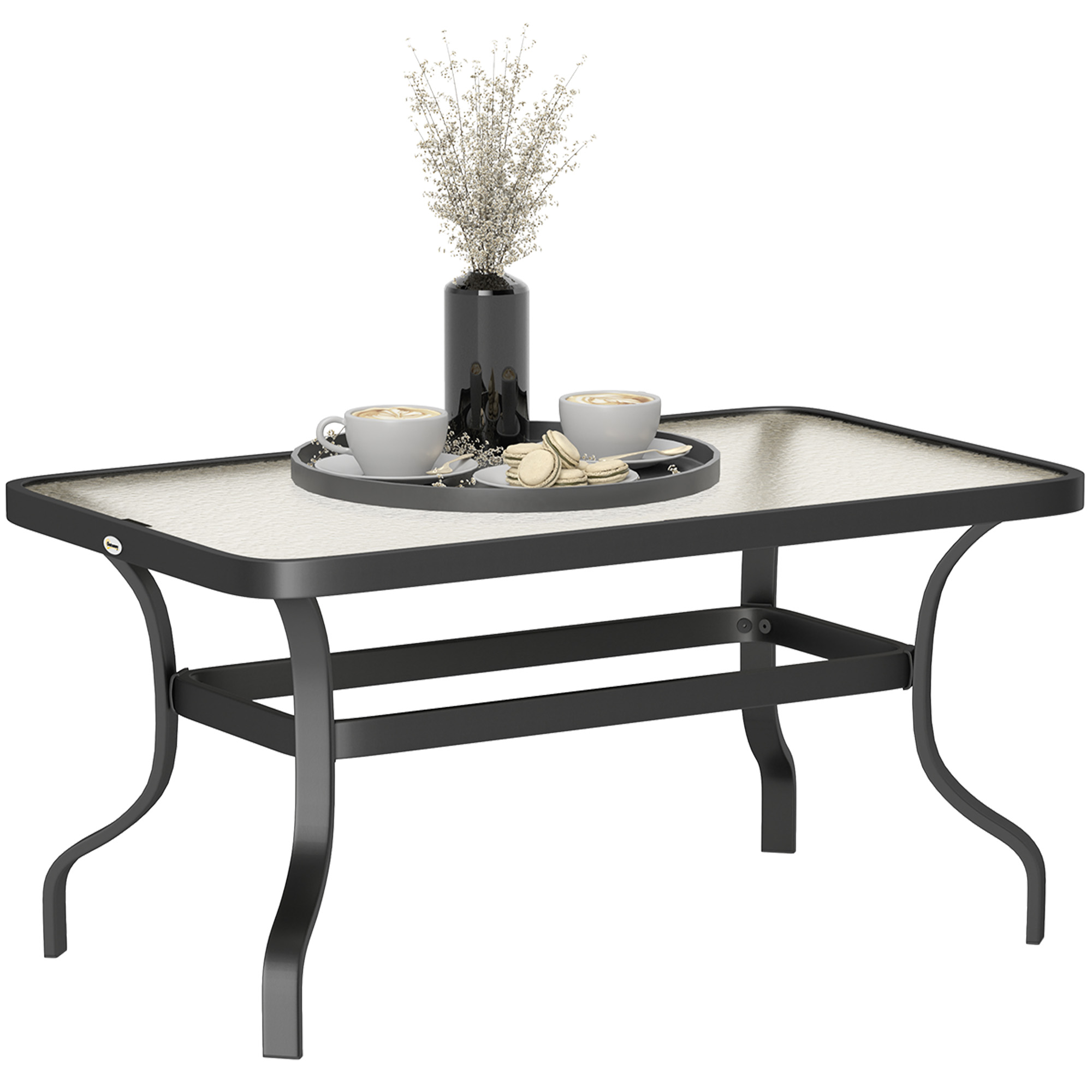 Tavolino in metallo nero con piano in vetro, vassoio con tazze e vaso con fiori.