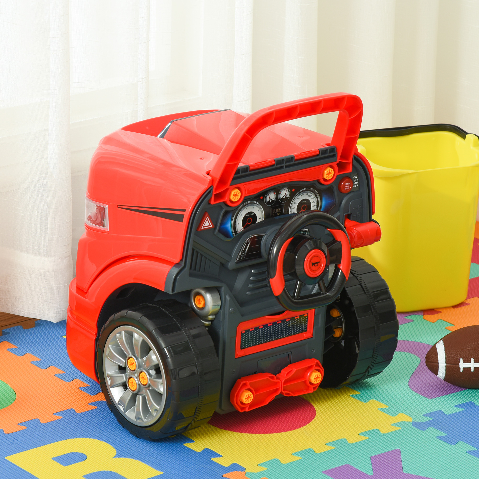 Giocattolo per bambini a forma di auto rosso e grigio, con volante e tappeto colorato.