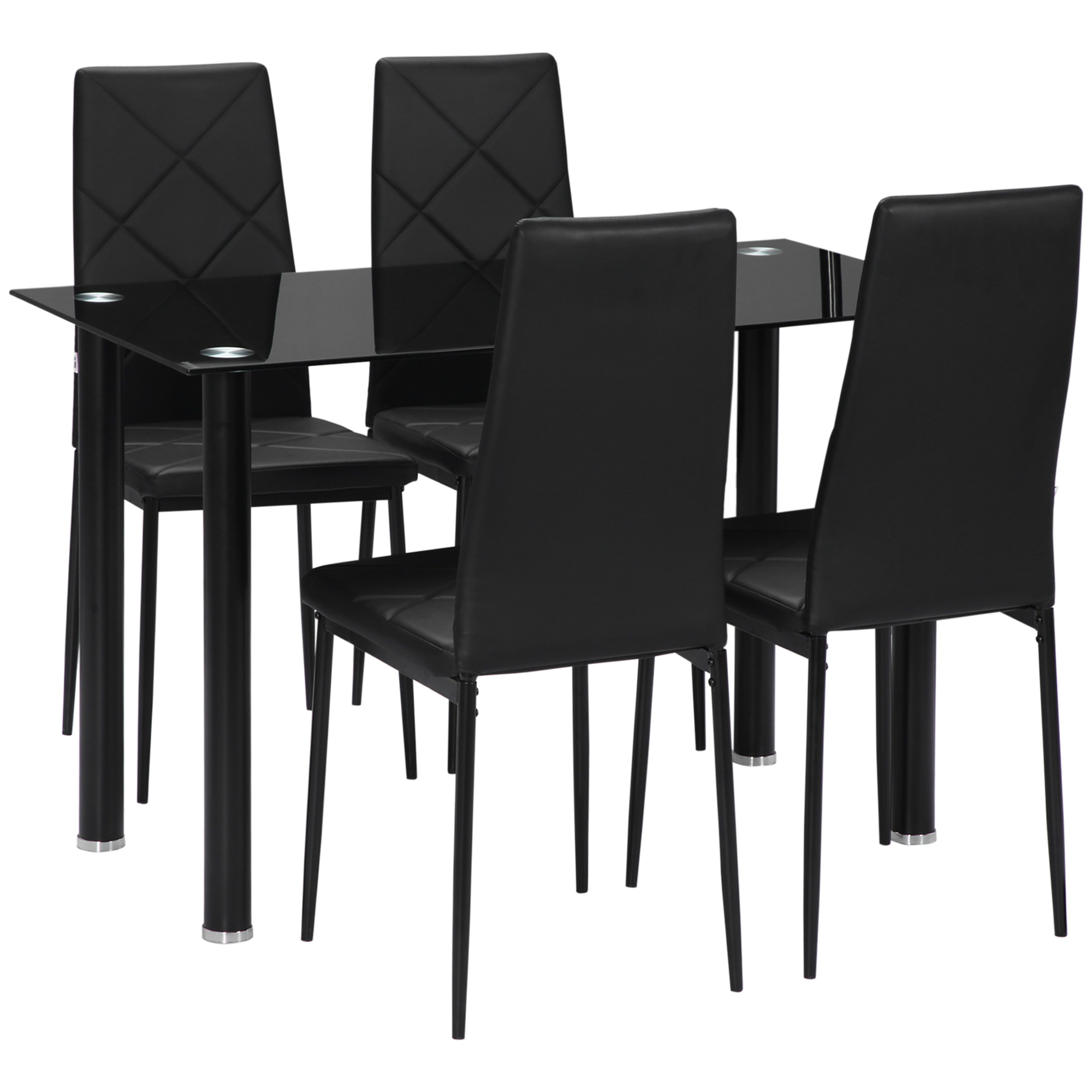 Tavolo da pranzo nero con quattro sedie nere. Il tavolo ha un piano in vetro. Le sedie hanno cuciture a diamante.