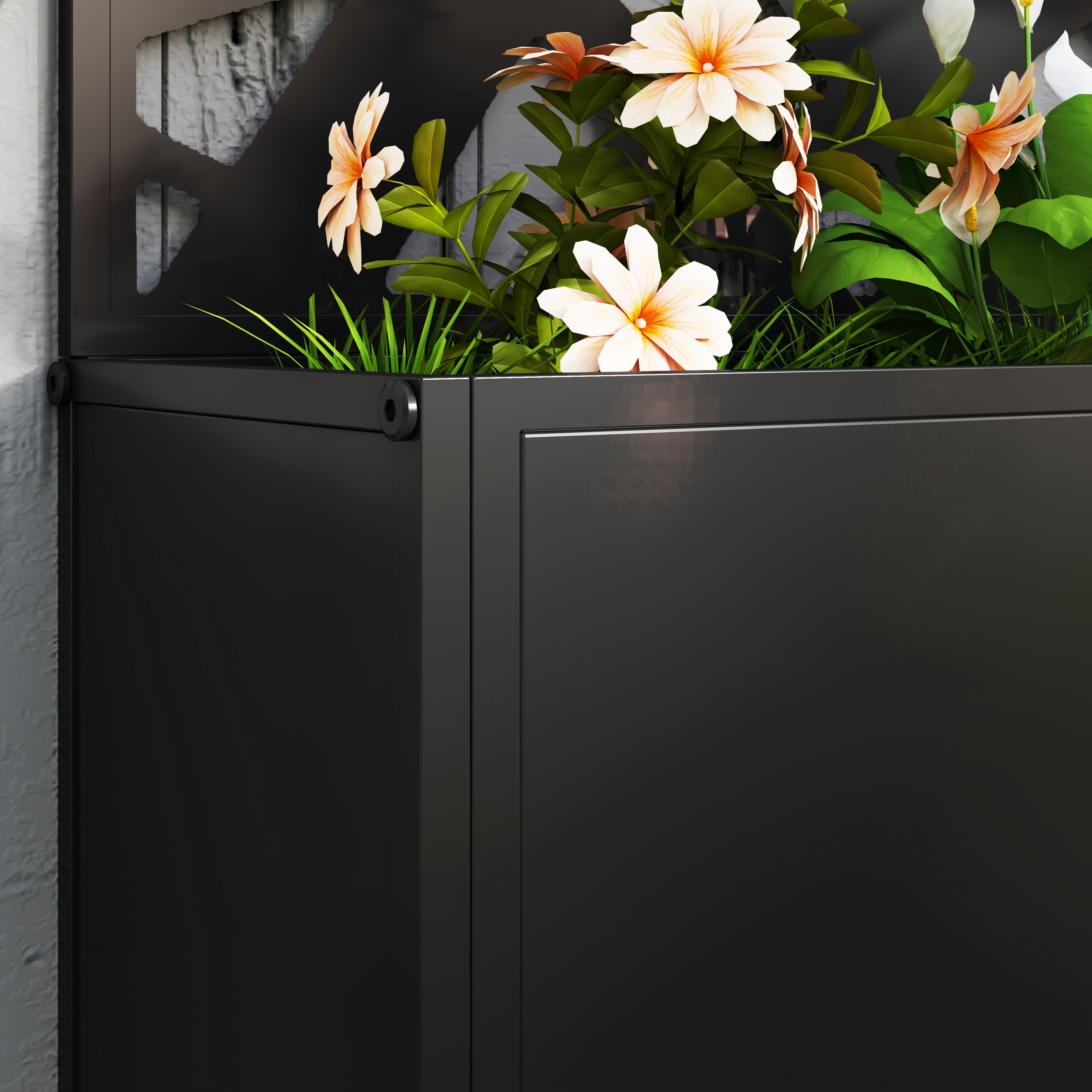 Un primo piano di una fioriera nera con fiori e verde. È montata a parete.