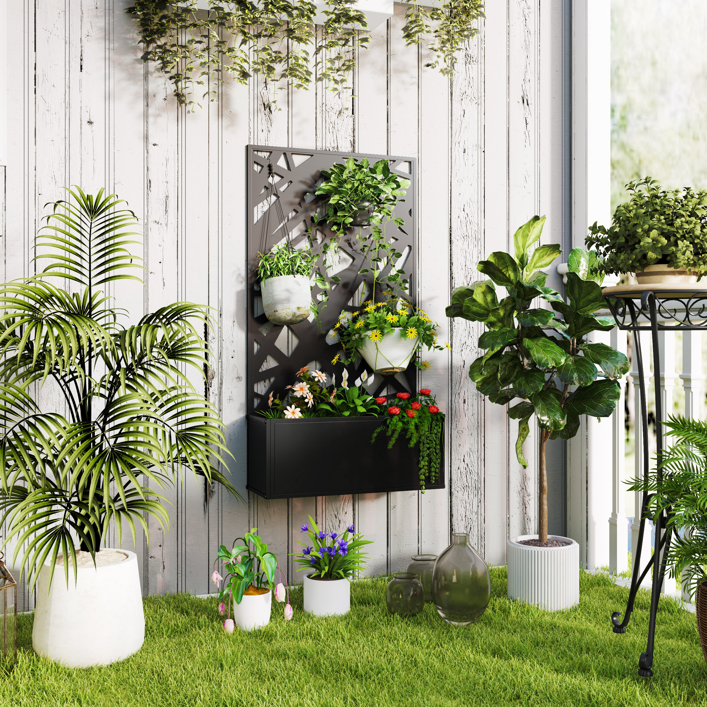 Un giardino verticale con piante. Alberi ed erba in primo piano. Sfondo di parete bianca.