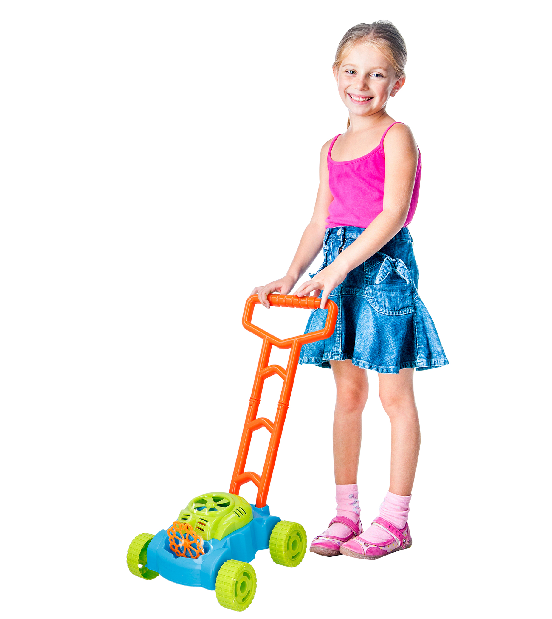 A young girl with a pink tank top and denim skirt is pushing a toy lawnmower.
