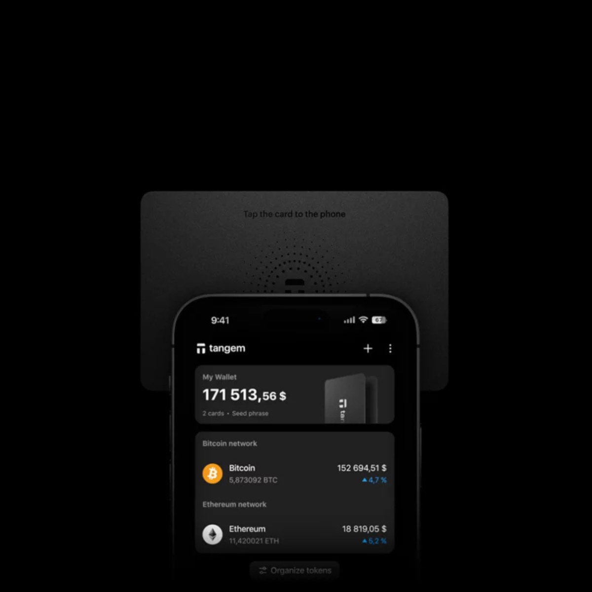 Telefon z aplikacją portfela kryptograficznego i czarną kartą na czarnym tle.