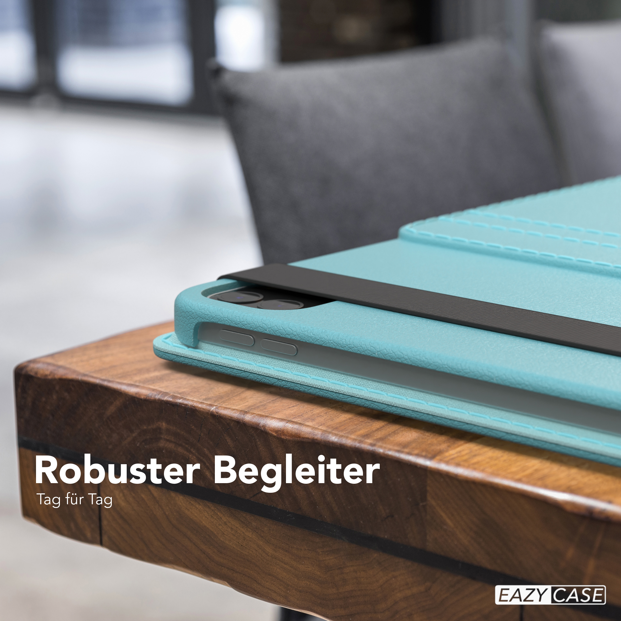Eine türkisblaue Tablethülle auf einem Holztisch mit dem Text 'Robuster Begleiter' darunter.