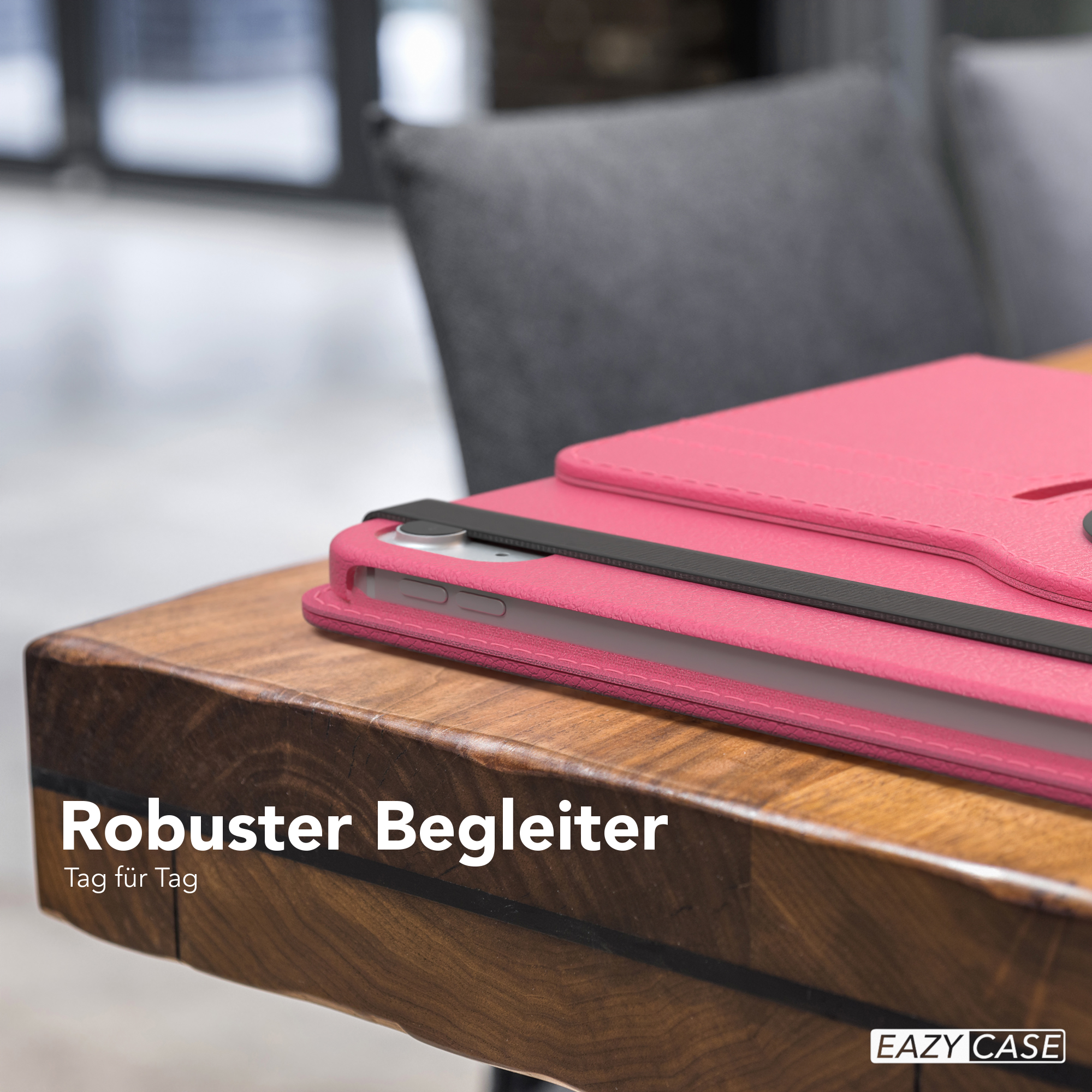 Rosa Tablethülle auf einem Holztisch, mit Text 'Robuster Begleiter'.
