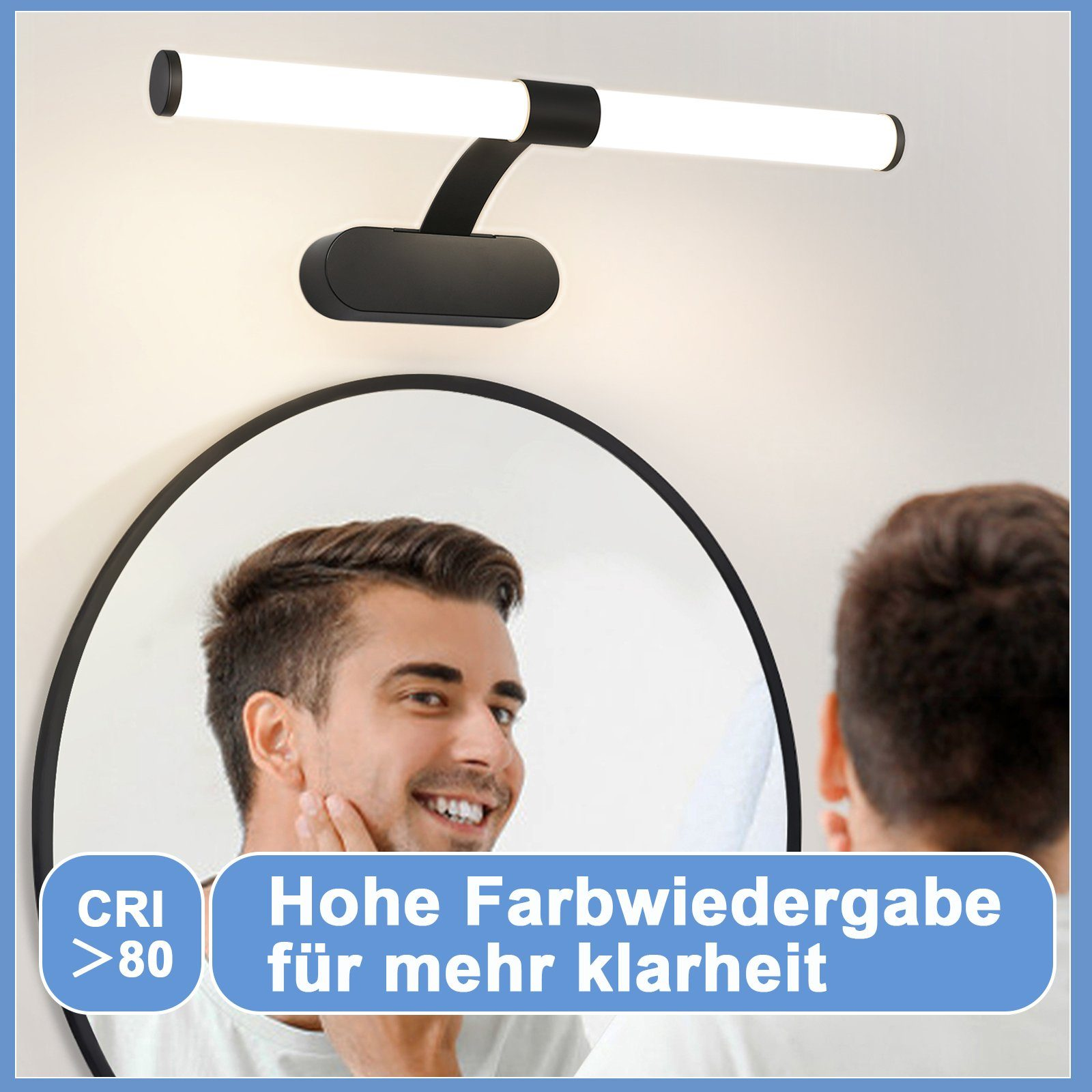 Un uomo che si guarda in uno specchio con una luce da bagno sopra. La luce e lo specchio sono neri.