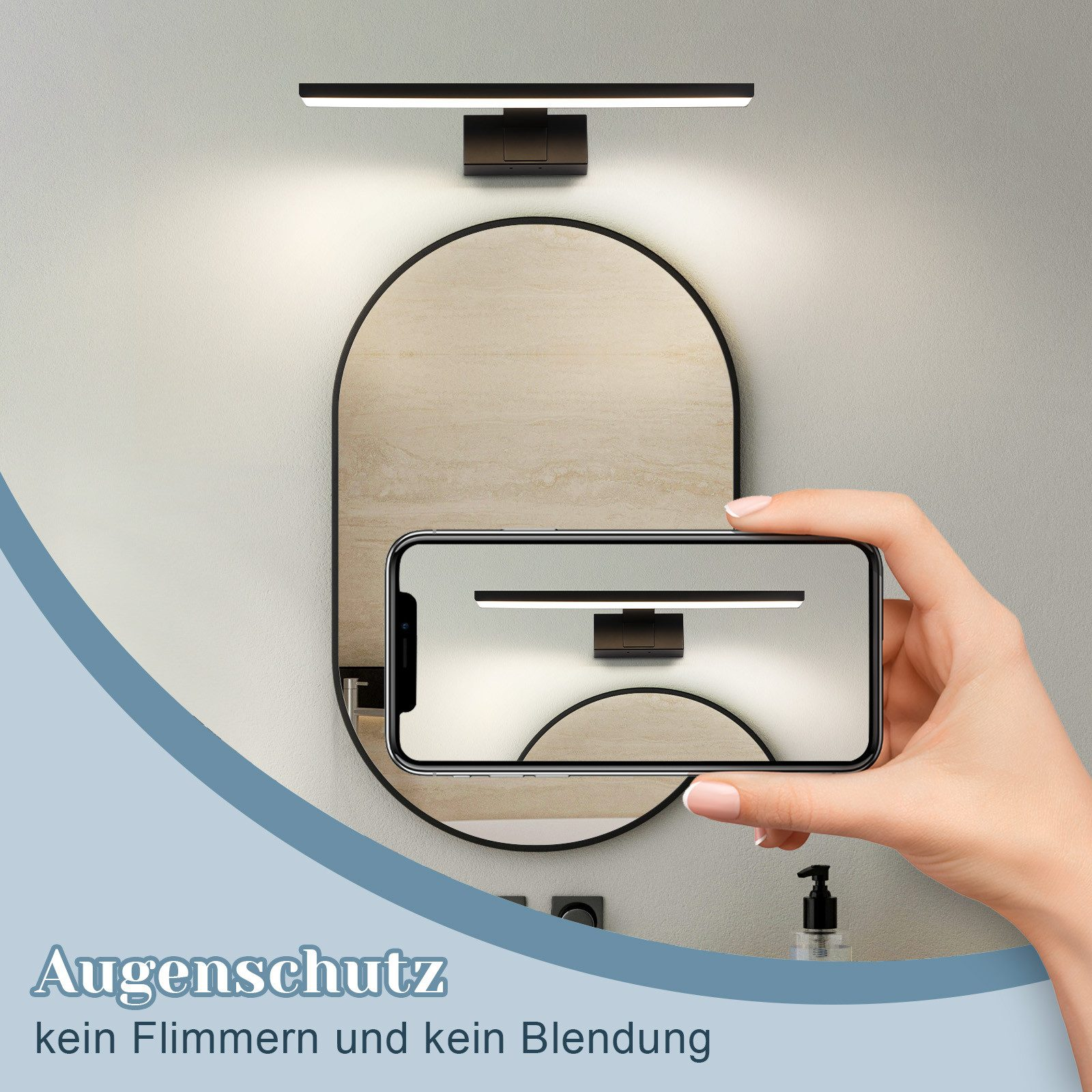 Person hält Handy mit Spiegel-Licht-Bild neben ovalem Spiegel.