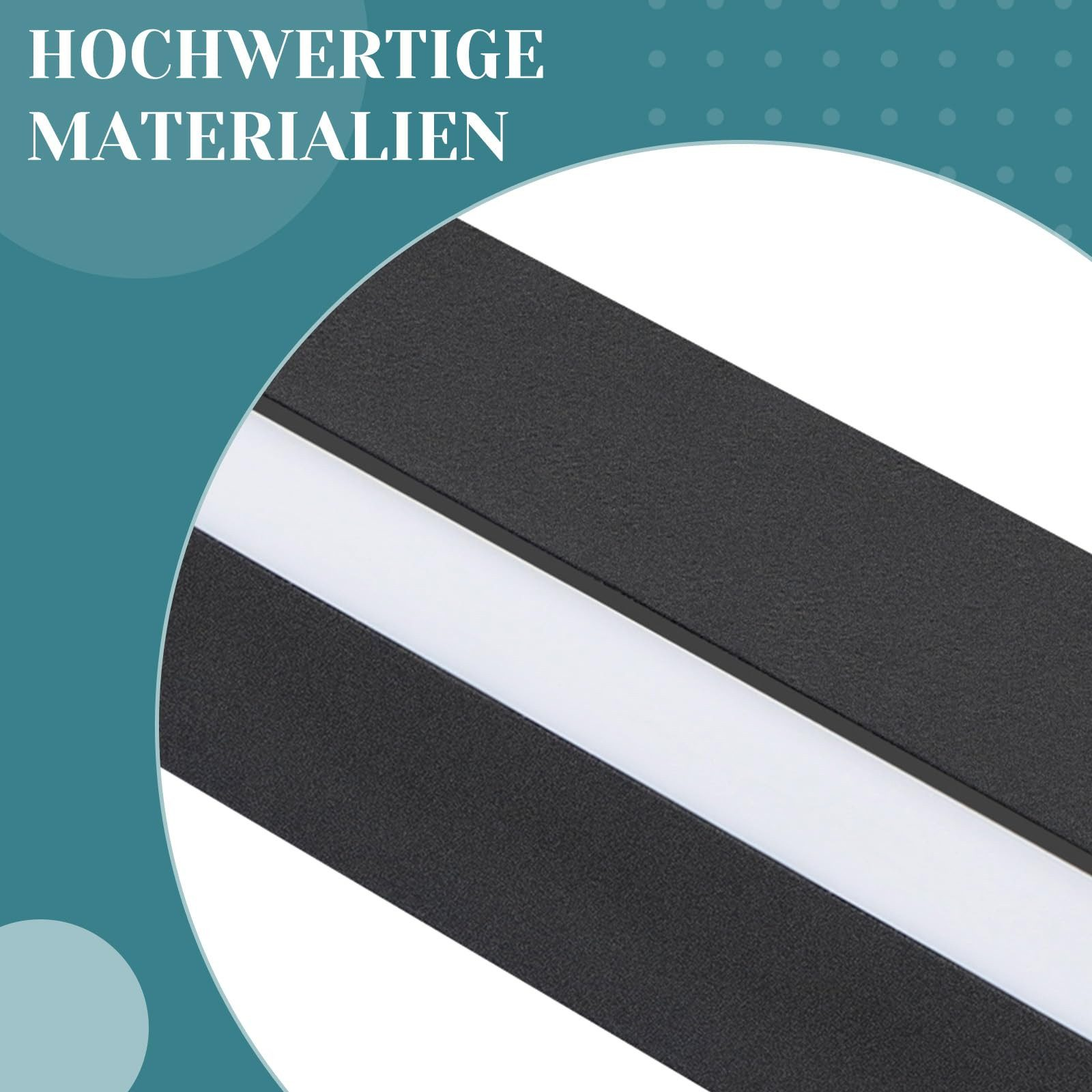 Primo piano di un'apparecchio di illuminazione in bianco e nero. La luce è bianca, l'apparecchio è nero.