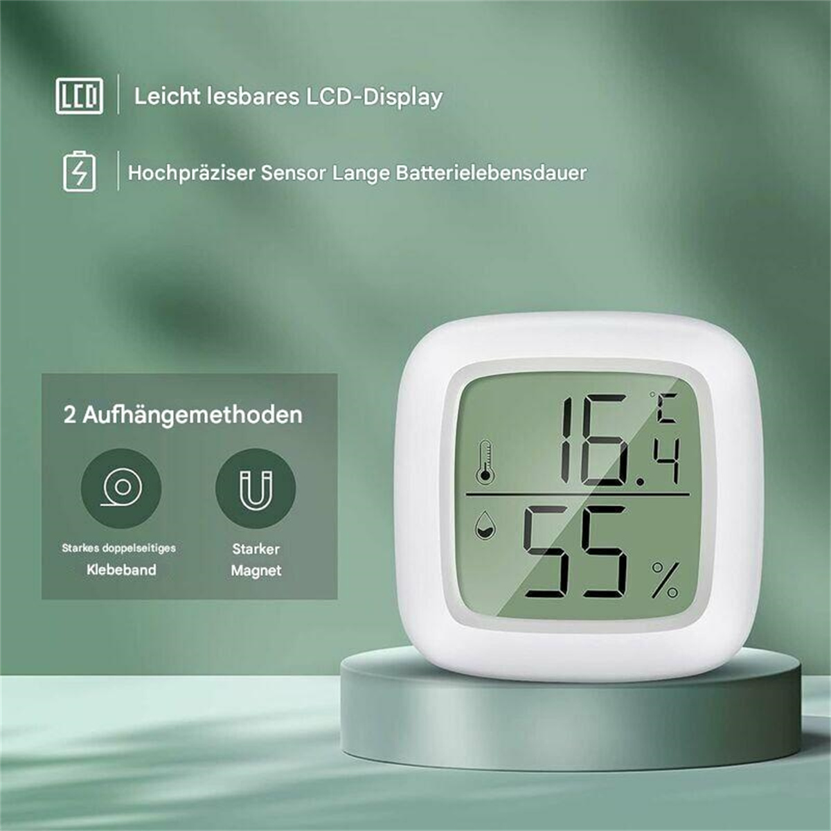 Ein weißes digitales Thermometer mit grünem Display, das Temperatur- und Feuchtigkeitswerte anzeigt.