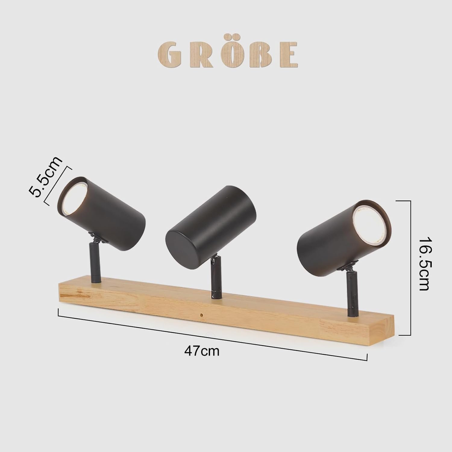 Tre faretti neri su base in legno. Dimensioni: 47 cm di lunghezza, 16,5 cm di altezza e 5,5 cm di larghezza.