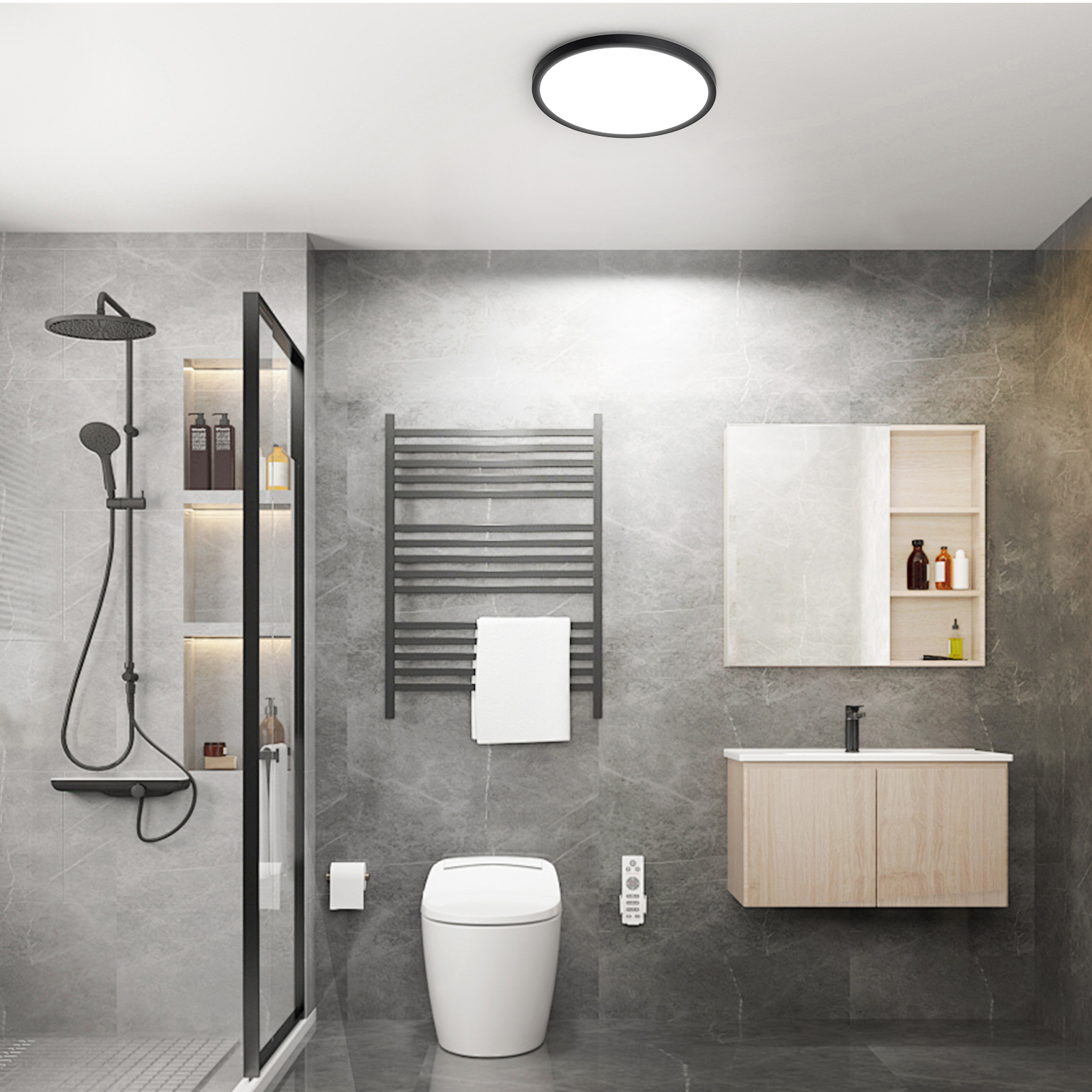 Un baño moderno con paredes de azulejos grises, un inodoro, una ducha y un tocador de madera con espejo.