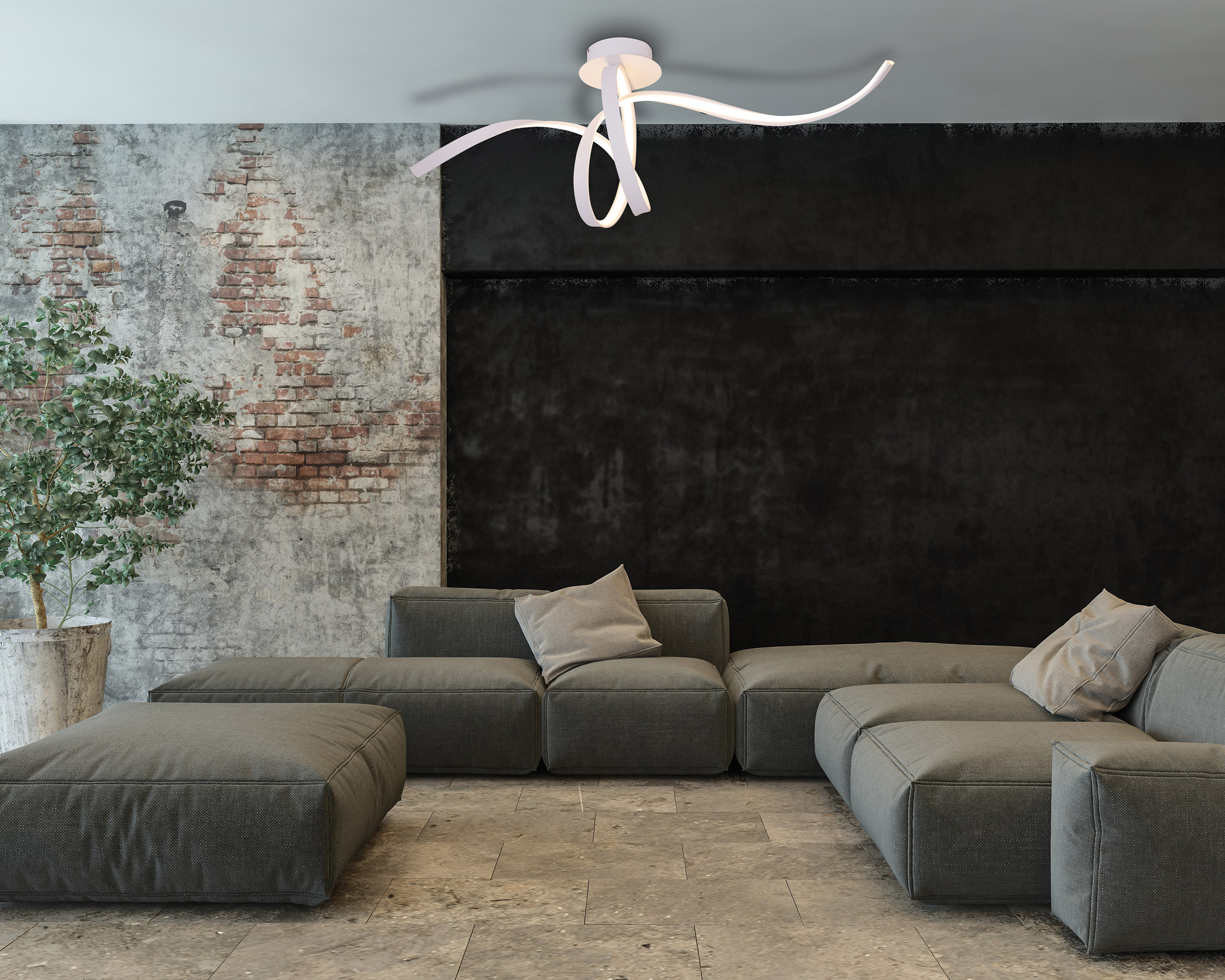 Ein modernes Wohnzimmer mit grauem Sofa, Backsteinmauer und weißer Deckenleuchte. Der Raum ist gut beleuchtet.