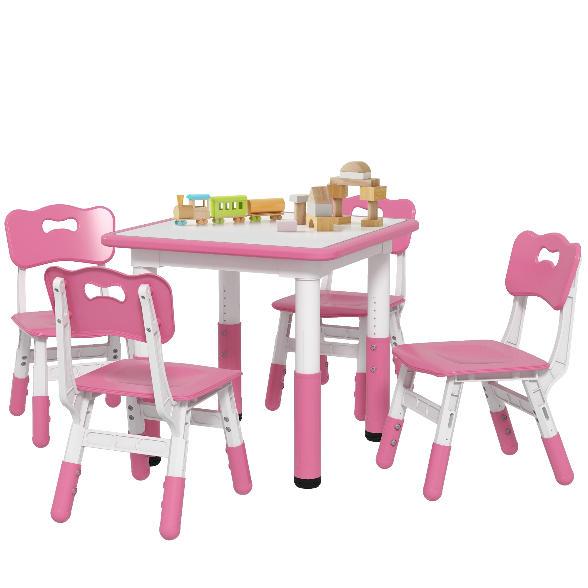 Set tavolo per bambini rosa e bianco con 4 sedie. Ci sono blocchi di legno e un trenino giocattolo sul tavolo.