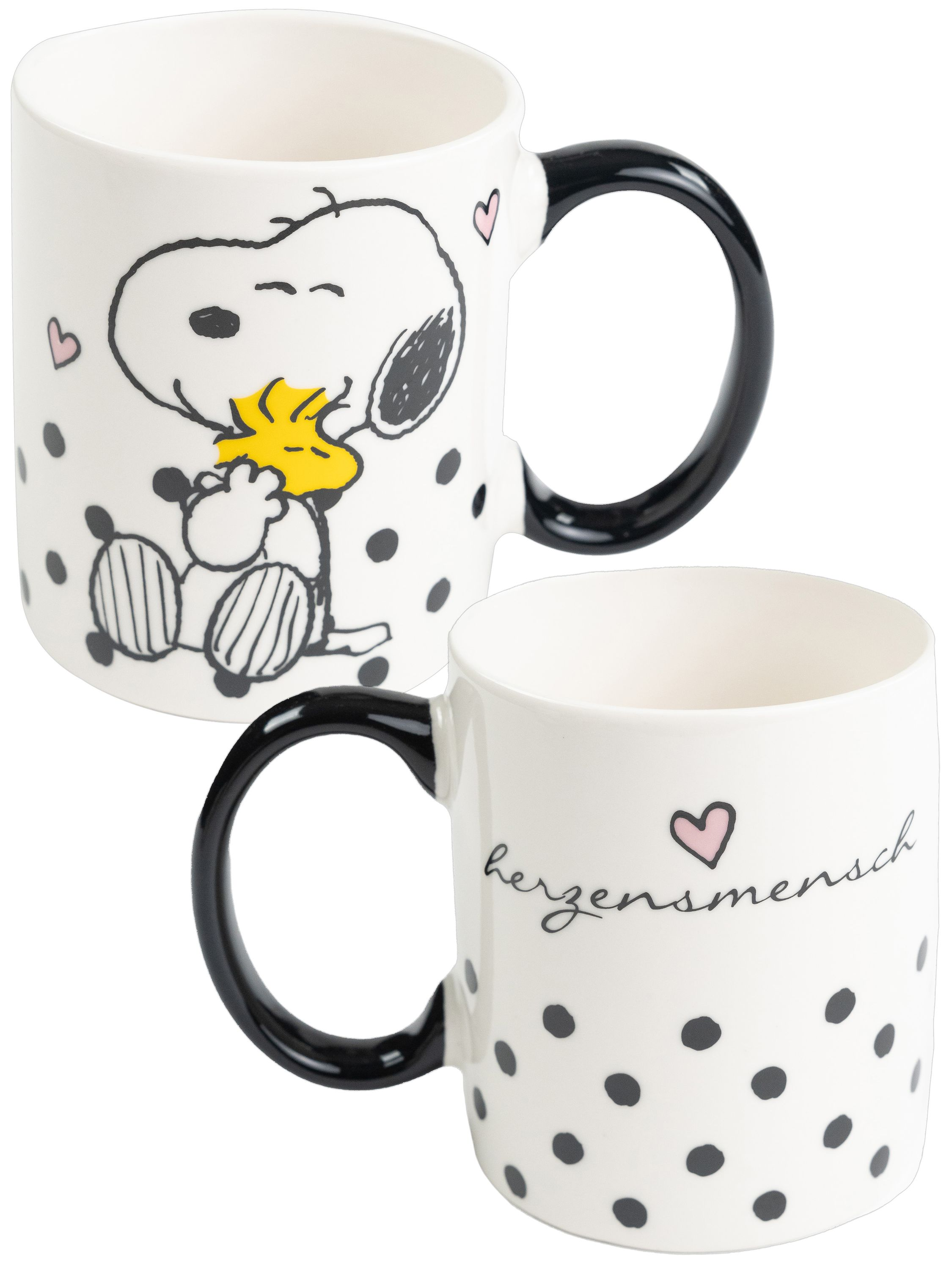 Zwei Tassen mit Snoopy und Woodstock. Schwarze Punkte und Henkel. Weißer Hintergrund.