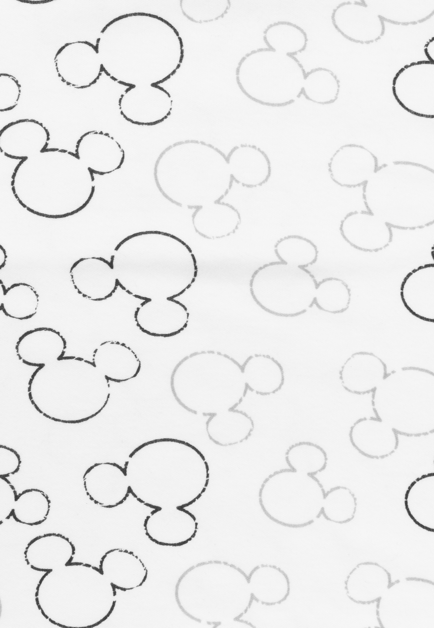 Ein weißer Stoff mit wiederholten Mickey Mouse Kopf-Silhouetten.