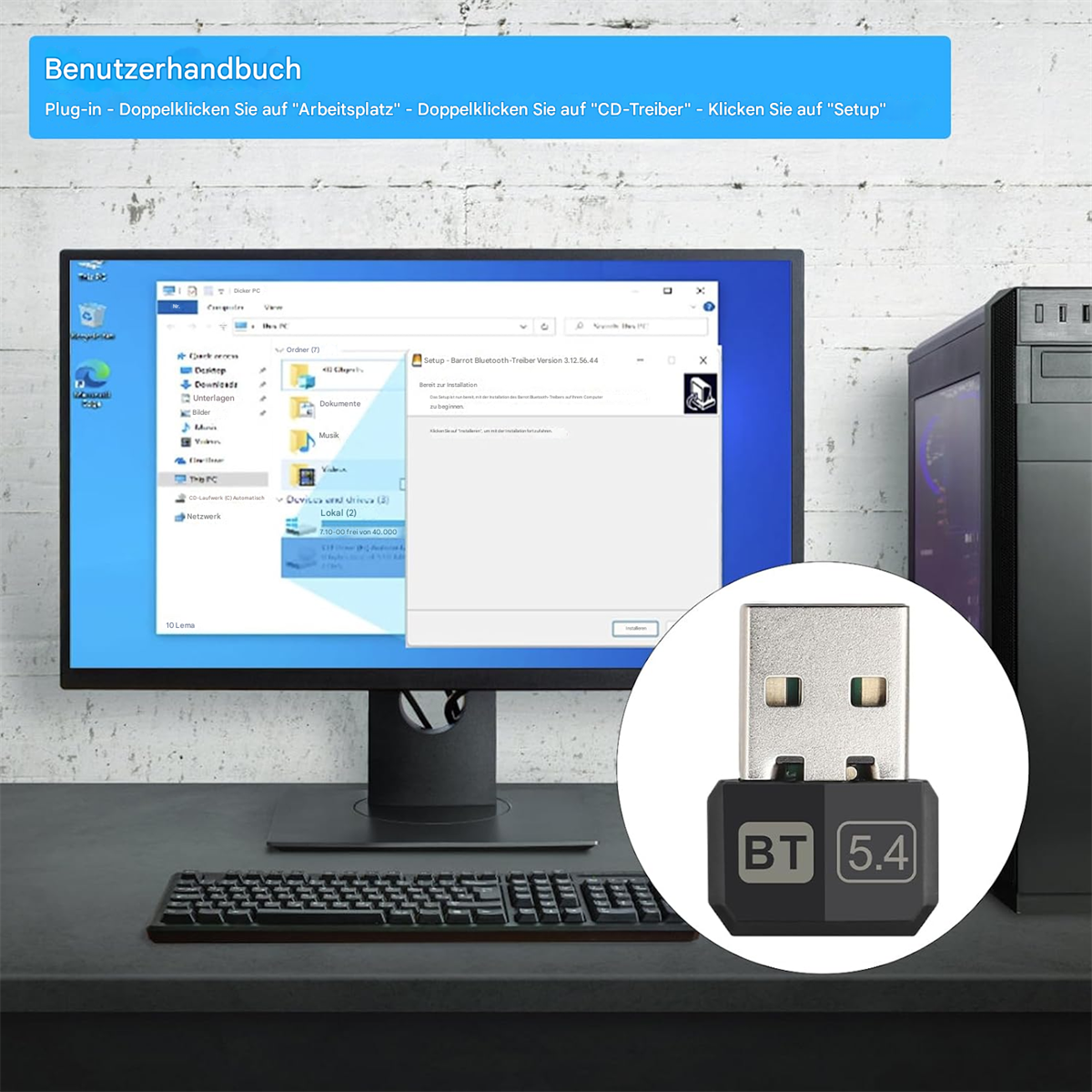 Ein Computer-Setup mit Monitor, Tastatur, Maus und einem USB-Bluetooth-Adapter.