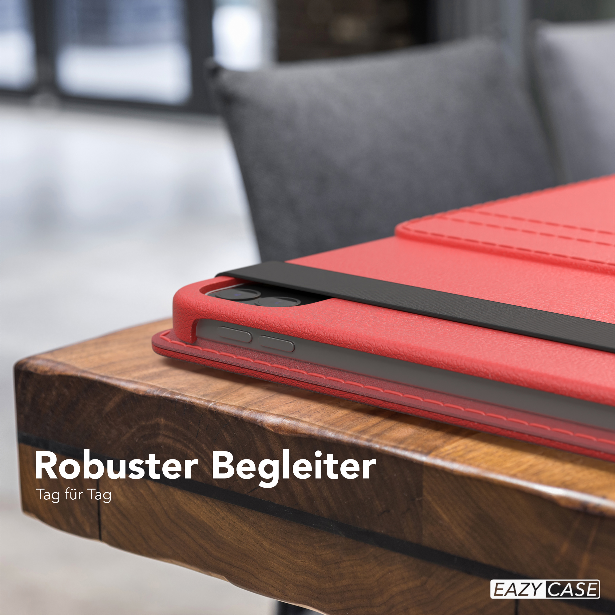 Rote Tablethülle auf einem Holztisch. Der Text 'Robuster Begleiter' ist sichtbar.
