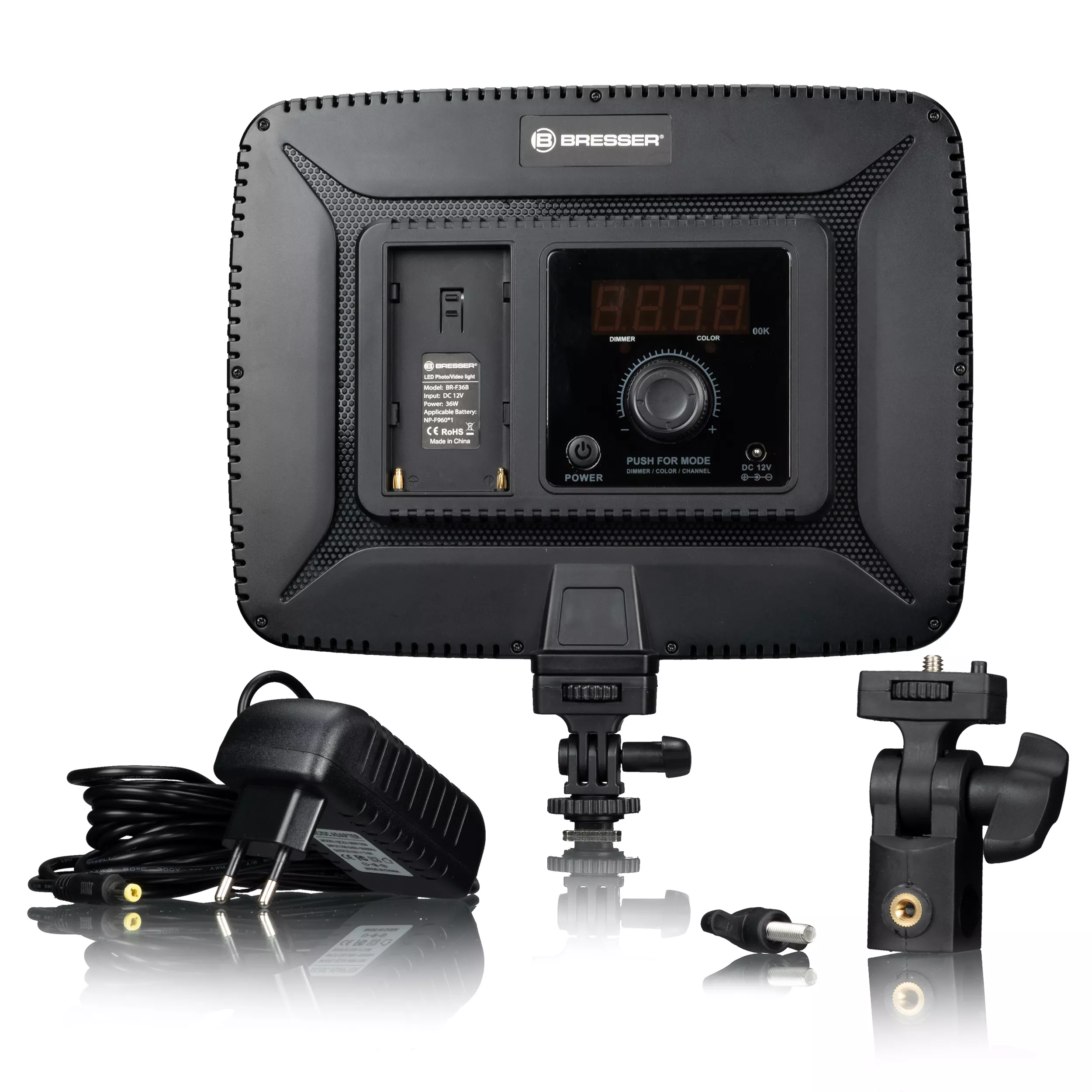 A black Bresser LED panel with controls and accessories, including a power adapter and bracket.