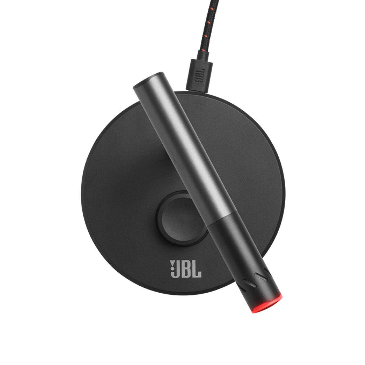 Schwarzes JBL-Mikrofon auf schwarzer Basis mit rotem Leuchtboden und schwarzem Hintergrund.