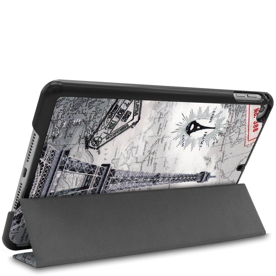 Tablet with a case featuring a map of Paris, Eiffel Tower, and stamps.