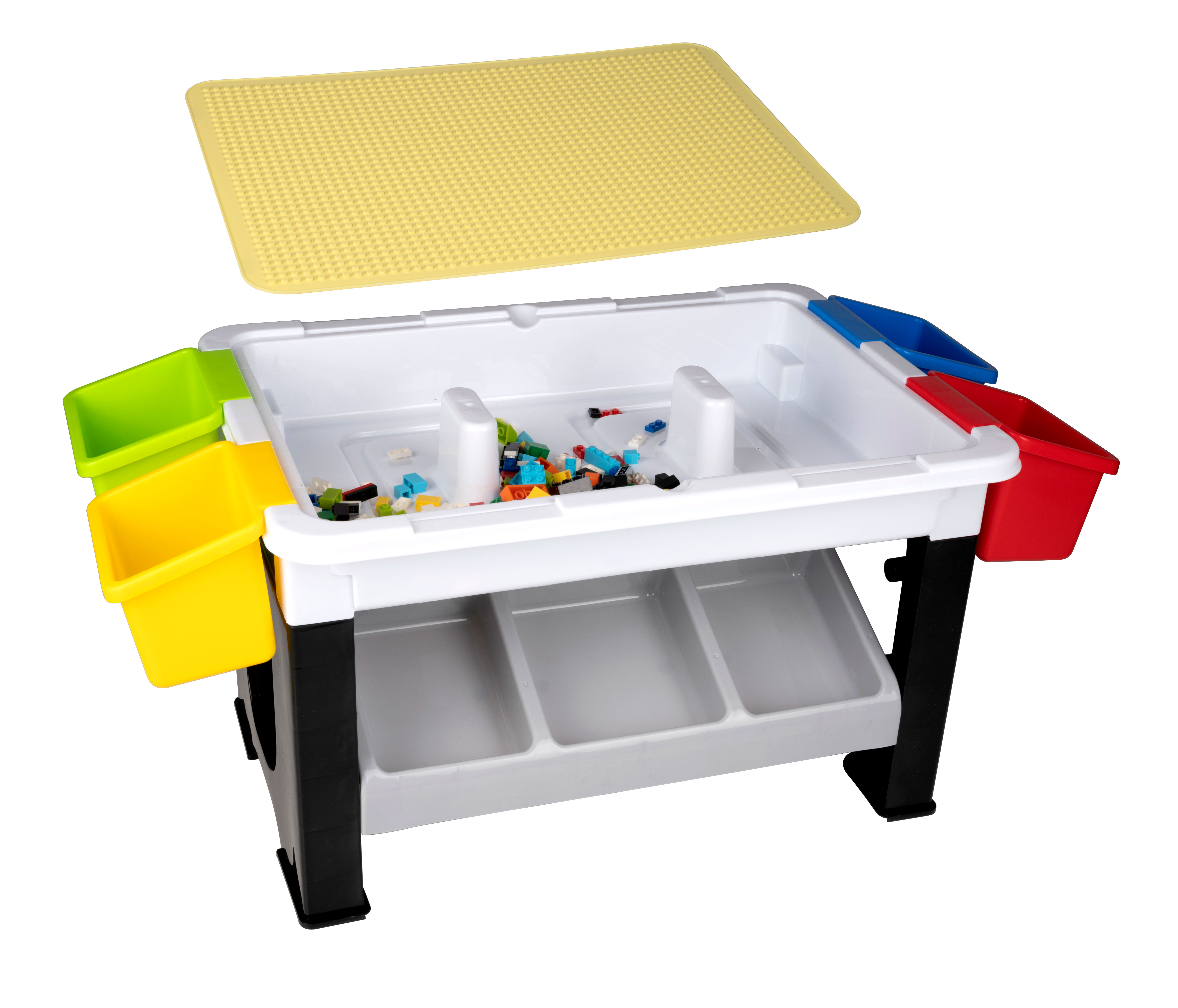 A white and black play table with colorful bins. It has a yellow lid and a white base with storage.