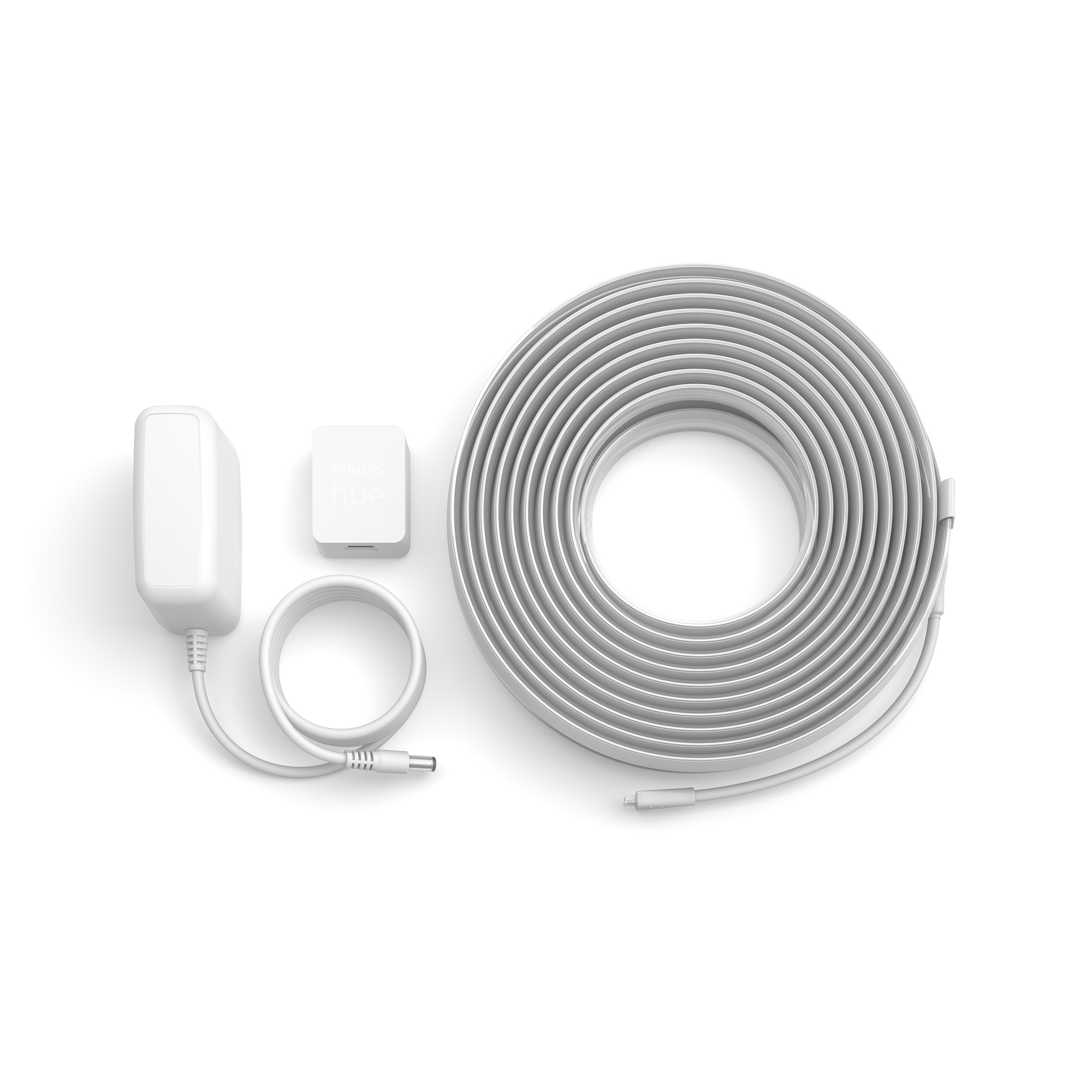 Composants de bande lumineuse LED blanche : adaptateur secteur, unité de contrôle et bande enroulée.