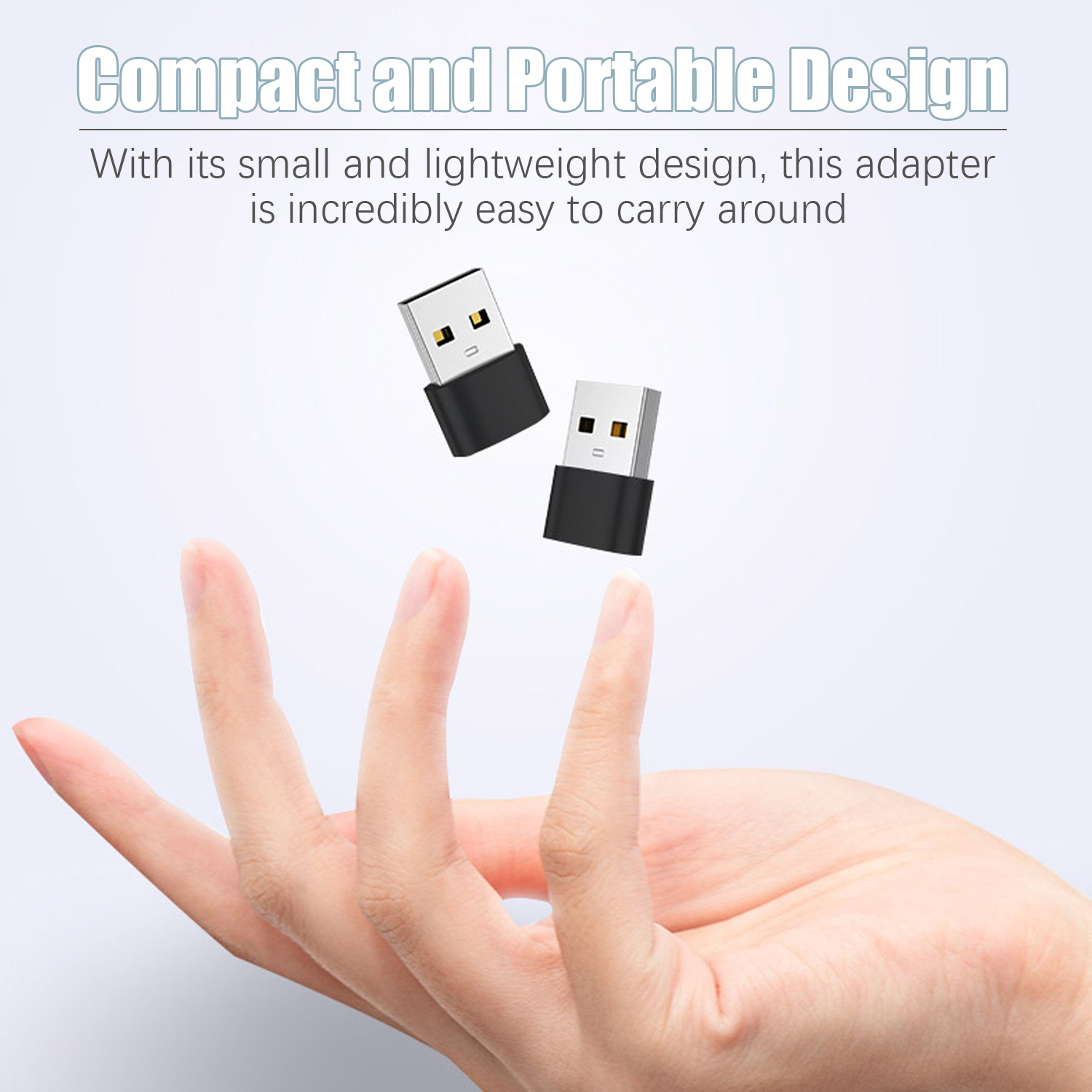 Dwa czarne adaptery USB unoszą się nad dłonią. Obraz ma jasnoniebieskie tło.