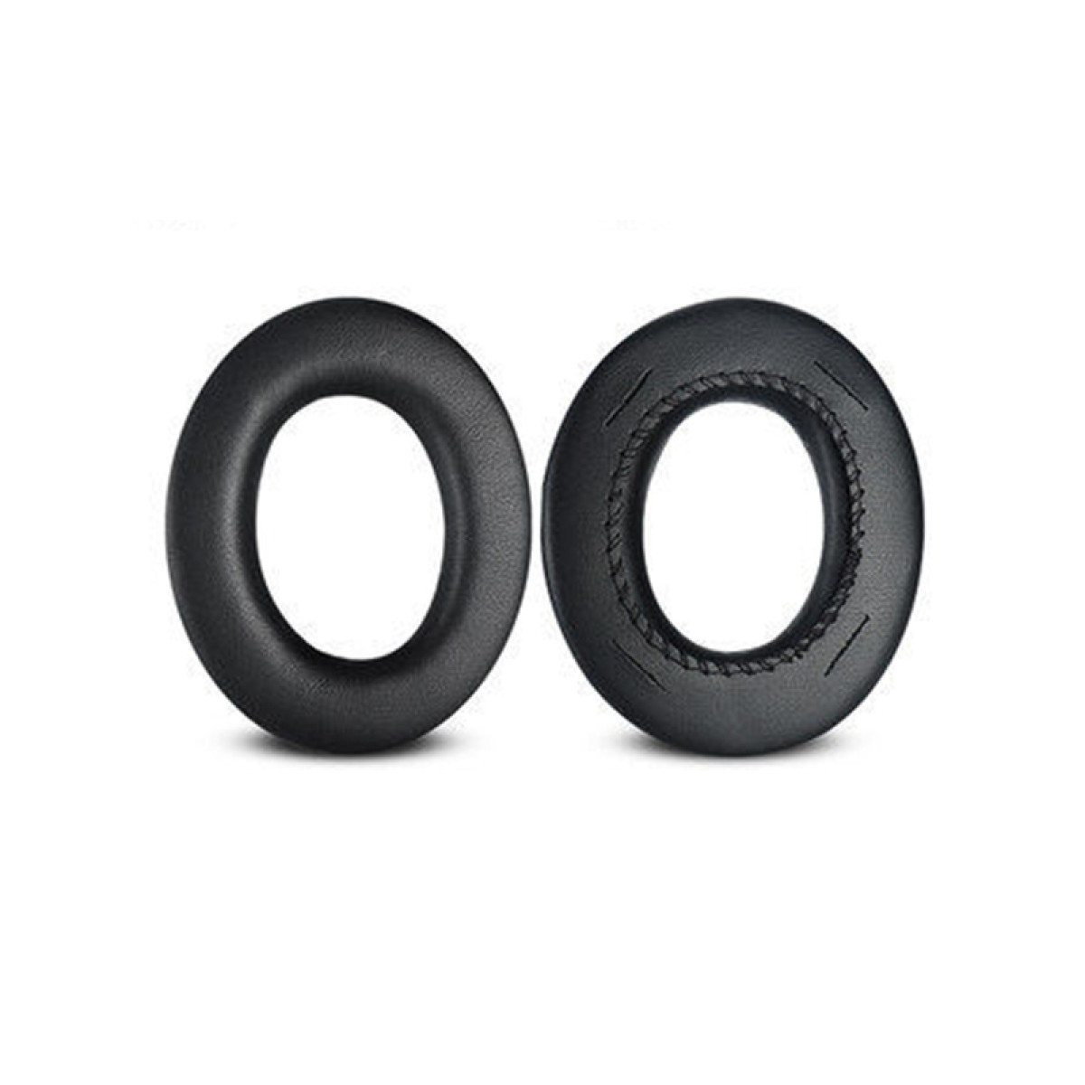 Dwie czarne, owalne nauszniki do słuchawek.