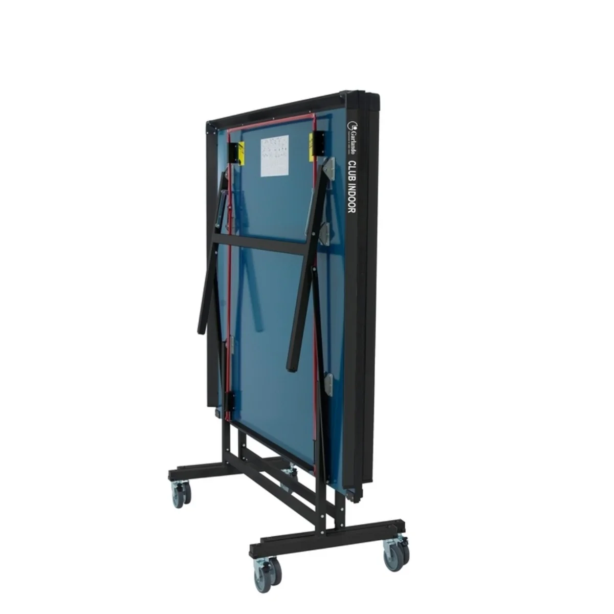 Blue ping pong table, folded. Black frame and legs with wheels. White background.