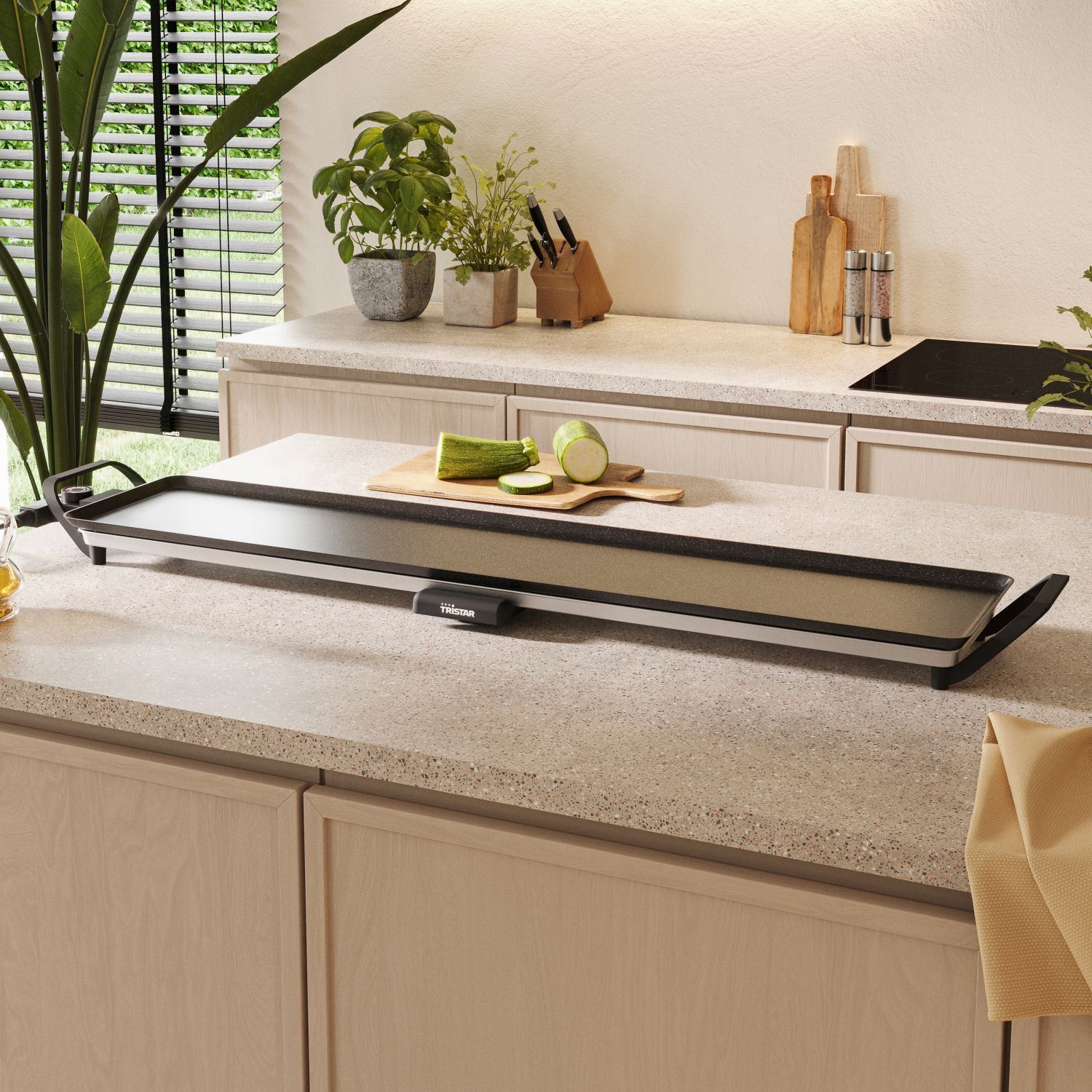 An electric griddle on a counter with vegetables.