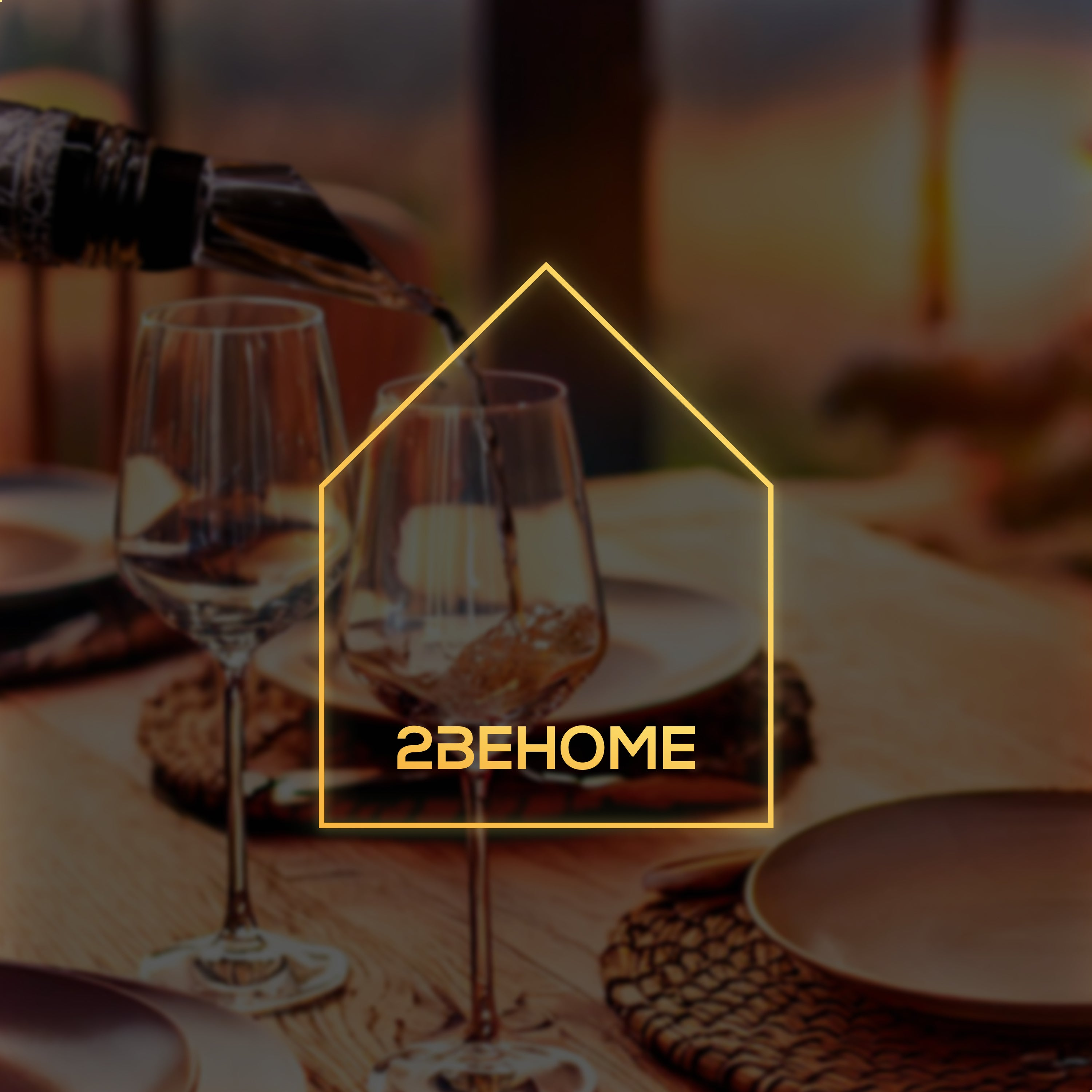 Wine being poured into glasses. A logo of a house with the text "2BEHOME" is visible.
