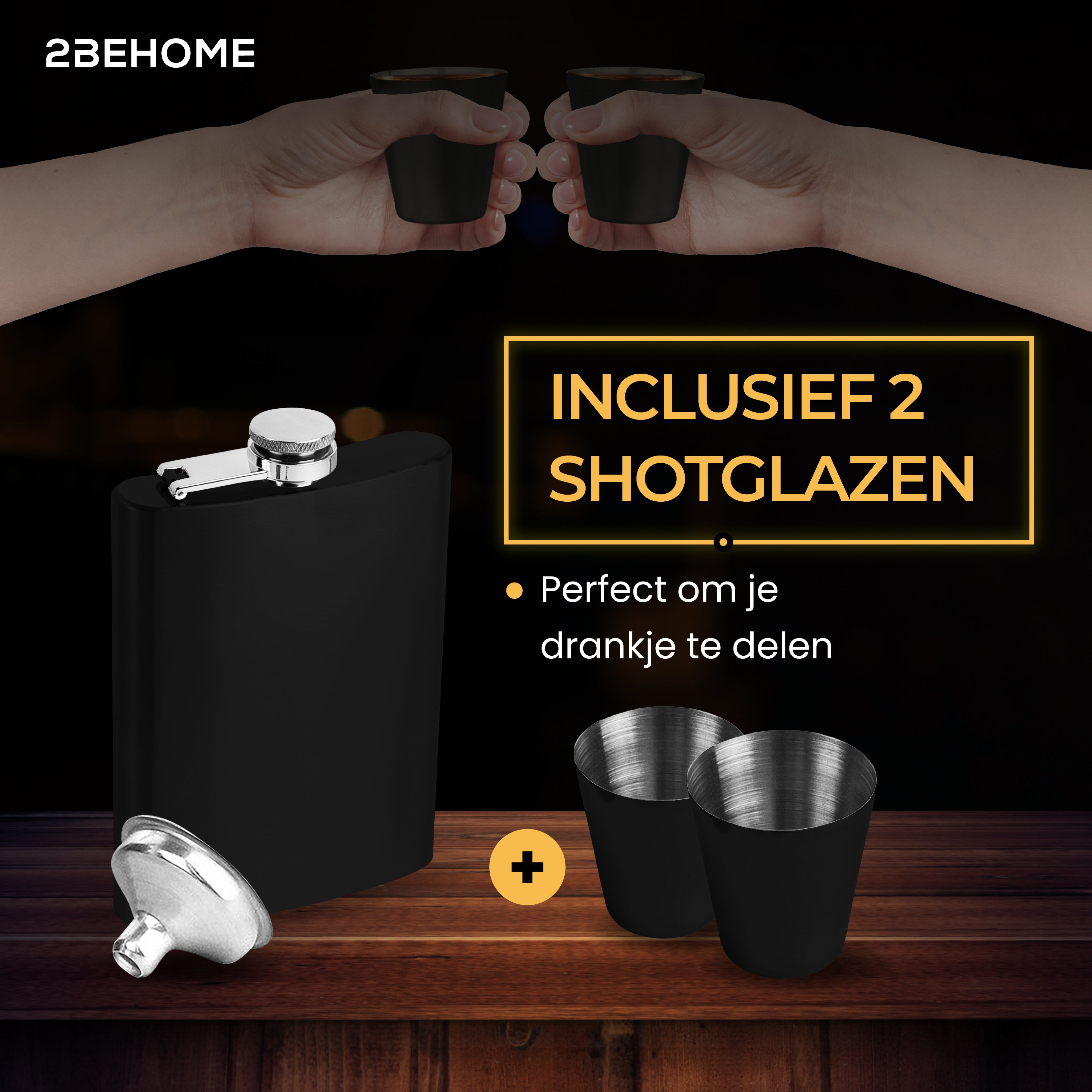 A black hip flask with two black shot glasses, on a wooden table, with hands holding the shots.