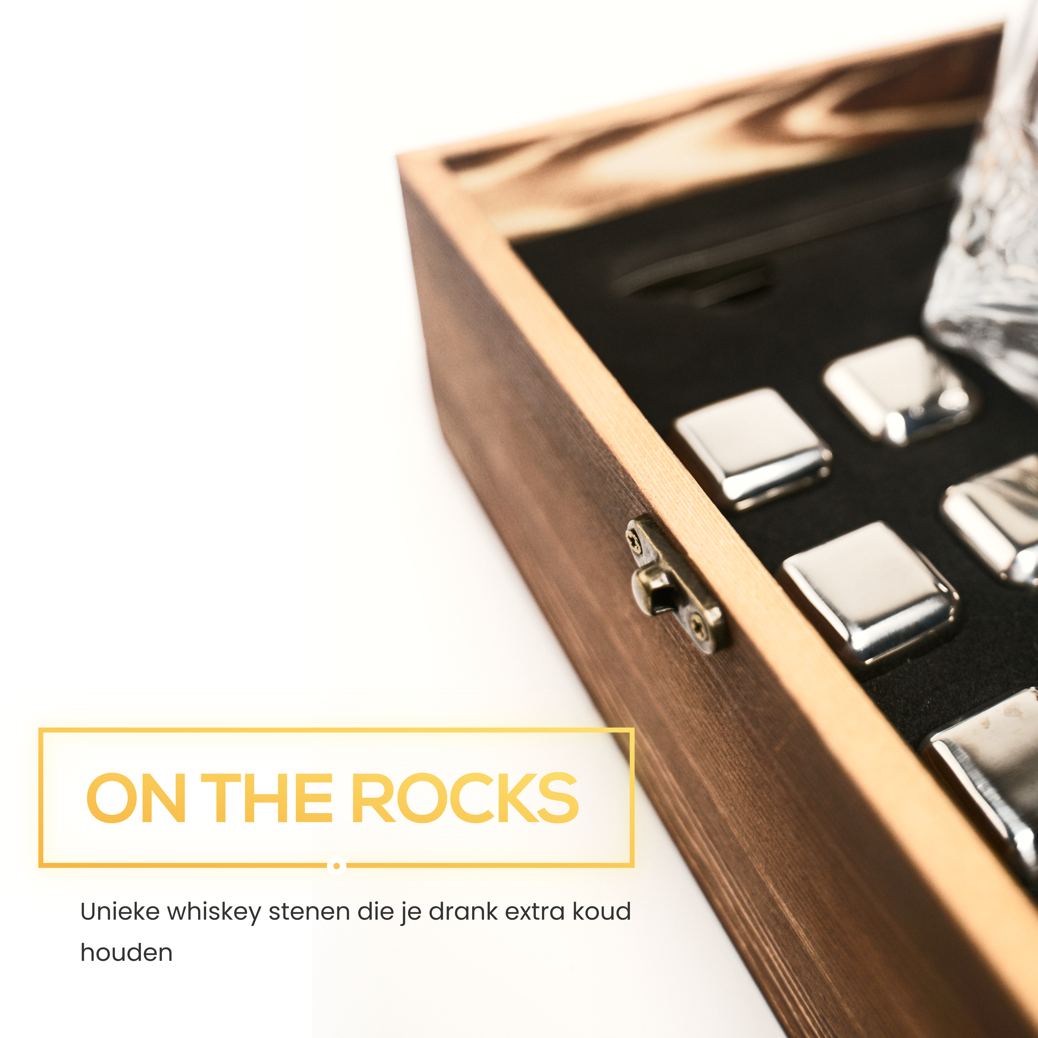 Wooden box with ice cubes, a glass of whiskey, and 'ON THE ROCKS' text.