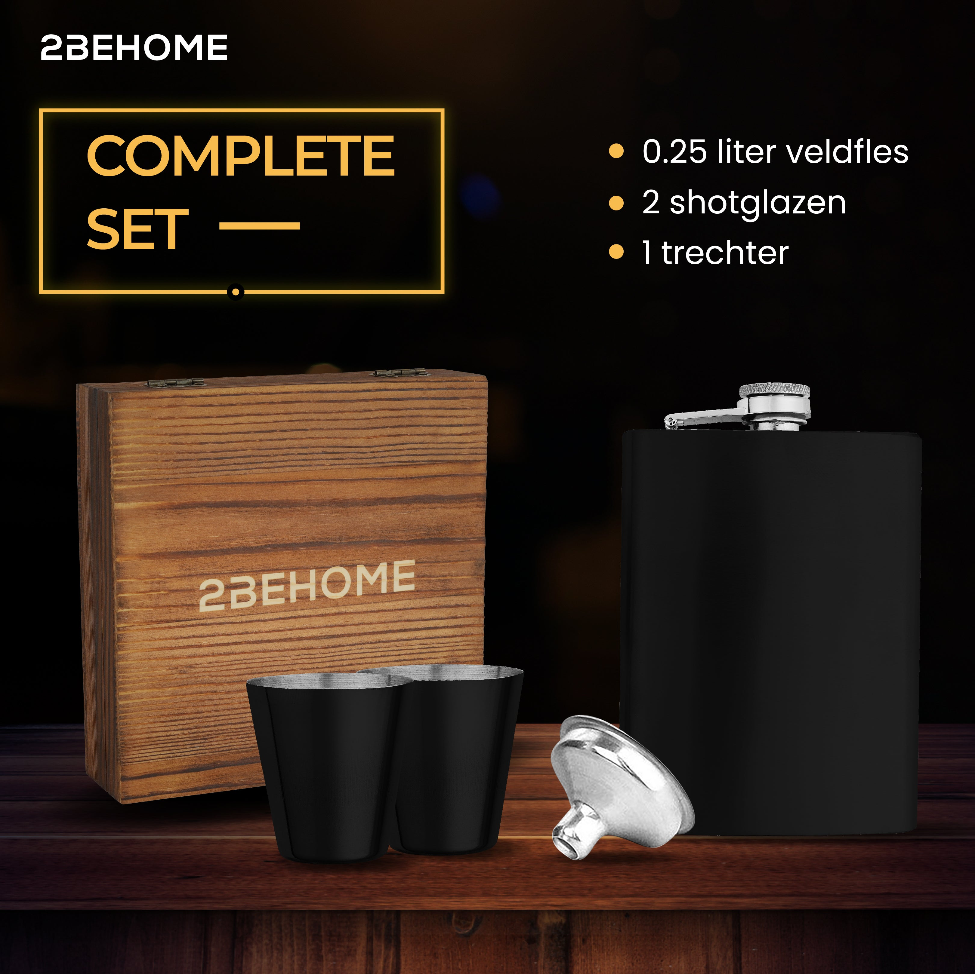 Complete set with a wooden box, two black shot glasses, a black flask with a silver cap, and a funnel.