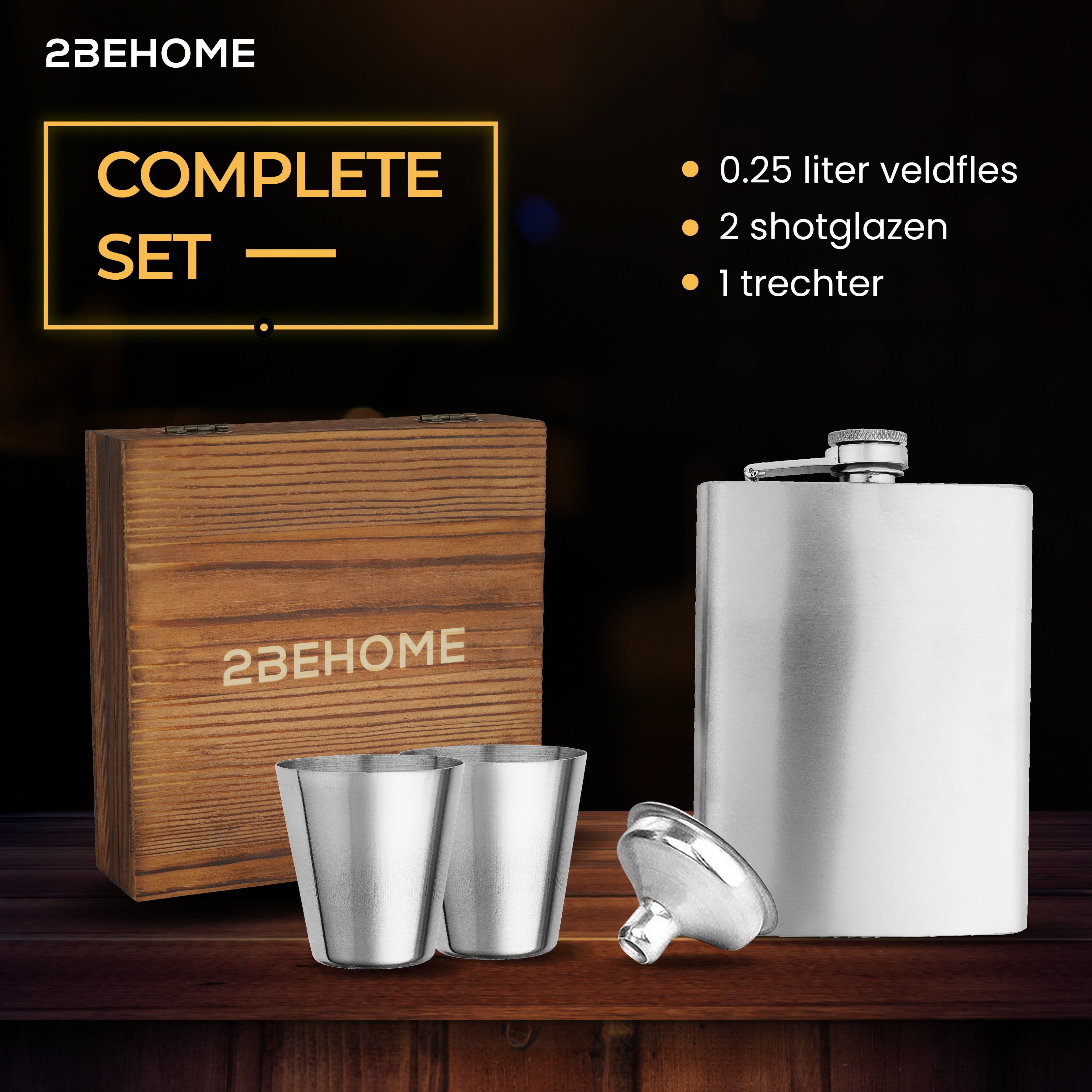 A wooden box, two shot glasses, and a flask.