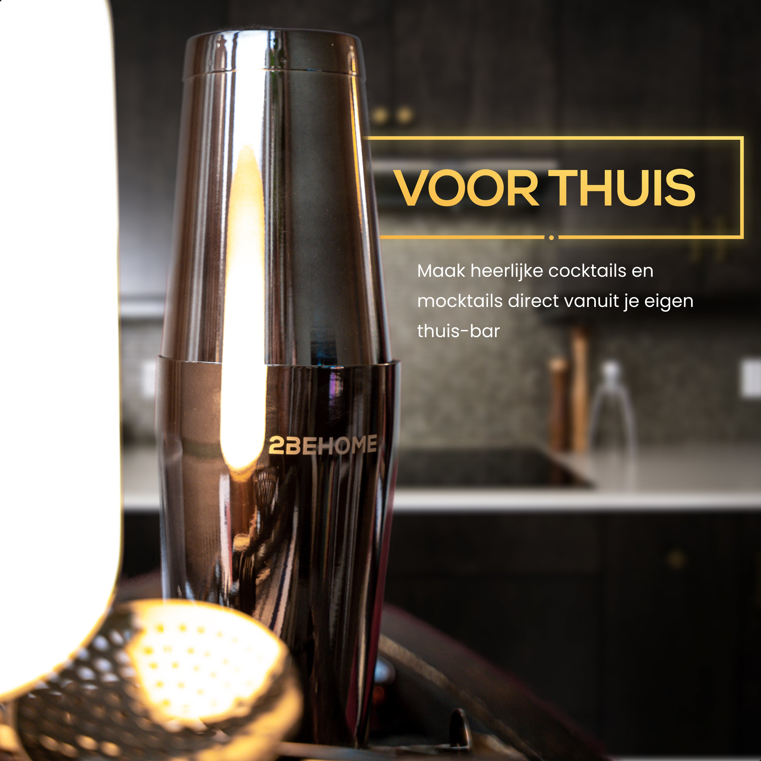 A black cocktail shaker with a blurred background of a kitchen.