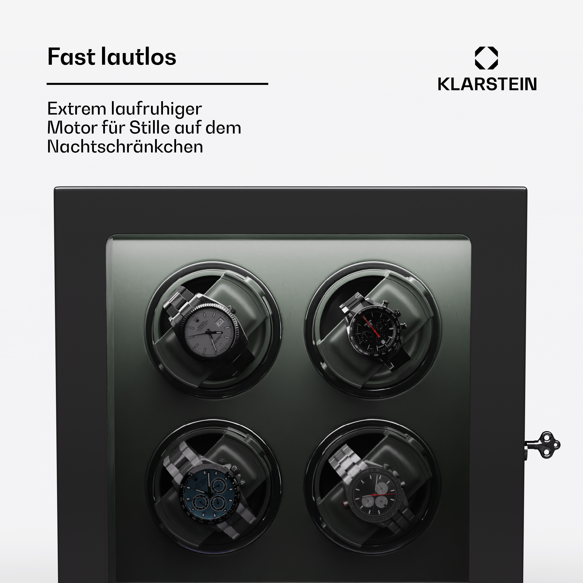 Uhrenbeweger mit vier Uhren. Schwarze Box mit Glastür. Schlüssel rechts. Text oben.