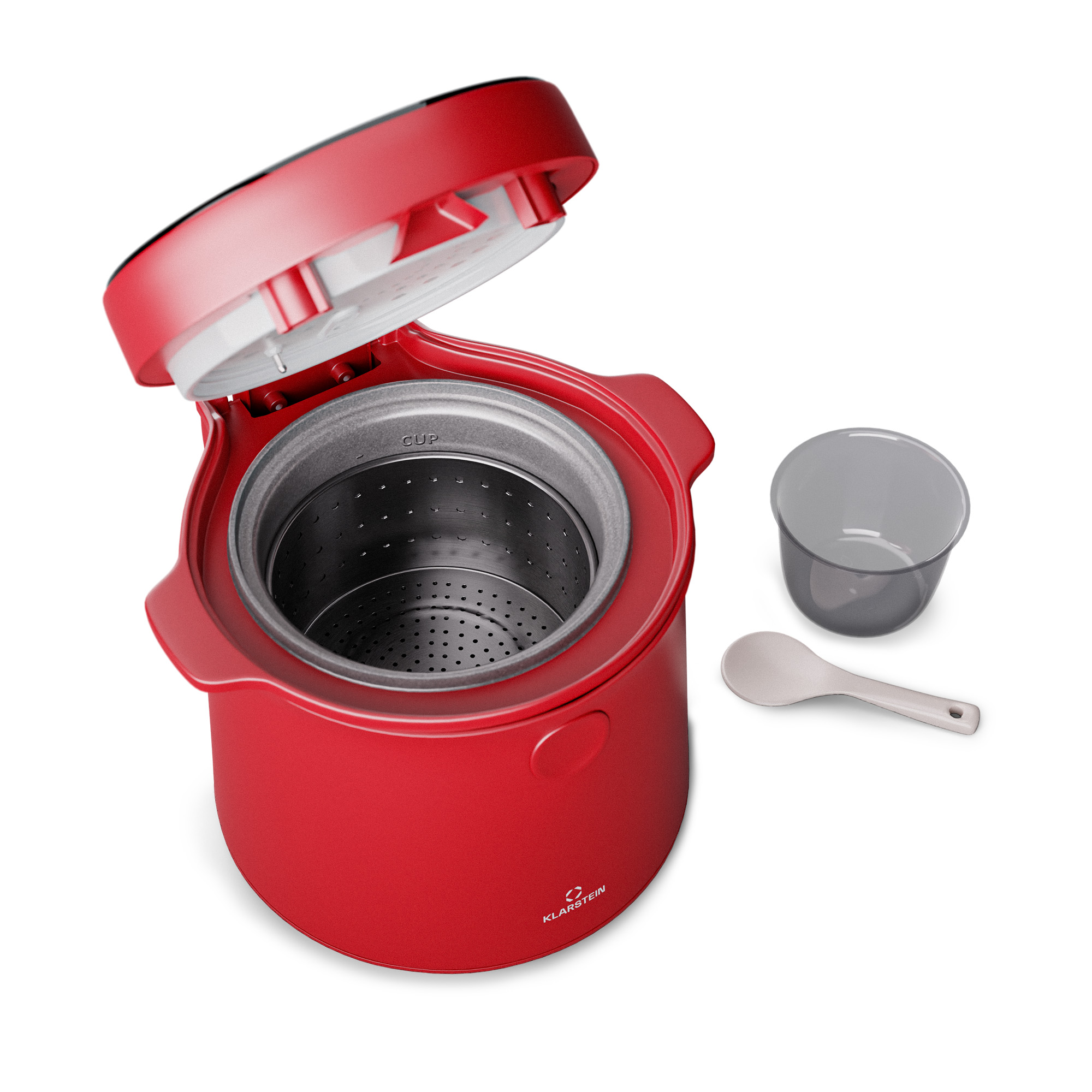 Rotes Gerät mit offenem Deckel, einem grauen Becher und einem Löffel. Alles auf weißem Hintergrund.