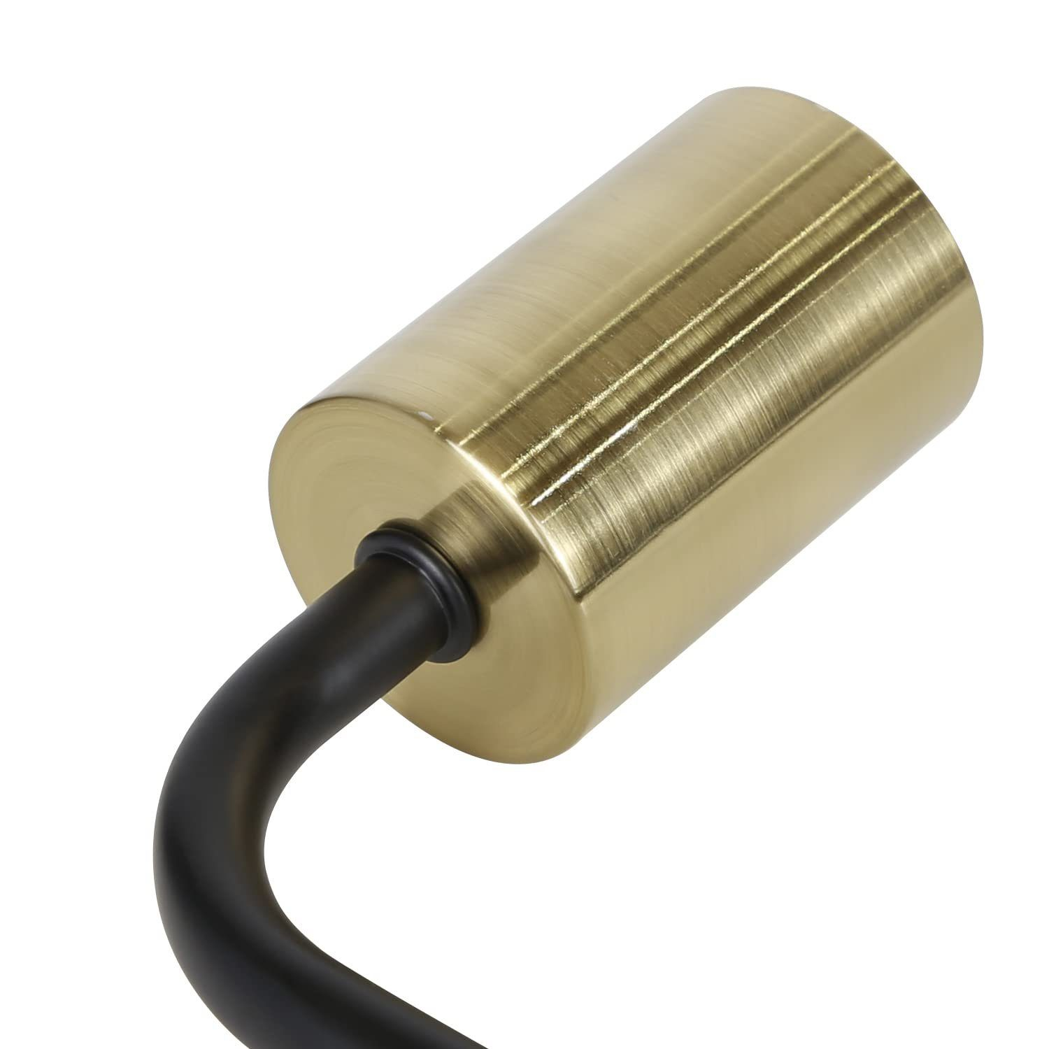 Zbliżenie mosiężnego elementu lampy z czarnym, zakrzywionym trzonem, na białym tle.