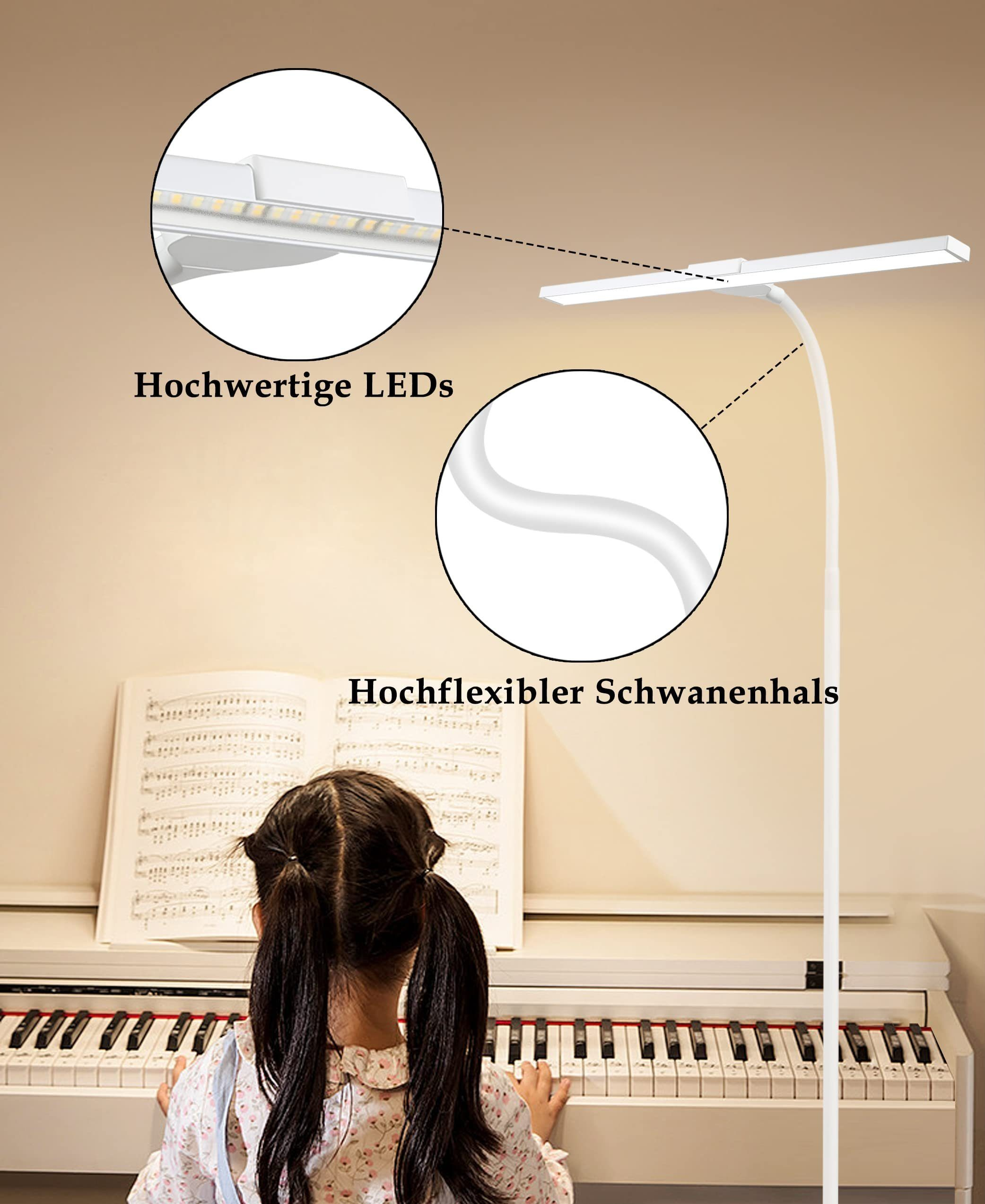 Una bambina al pianoforte, illuminata da una lampada LED bianca con collo flessibile.