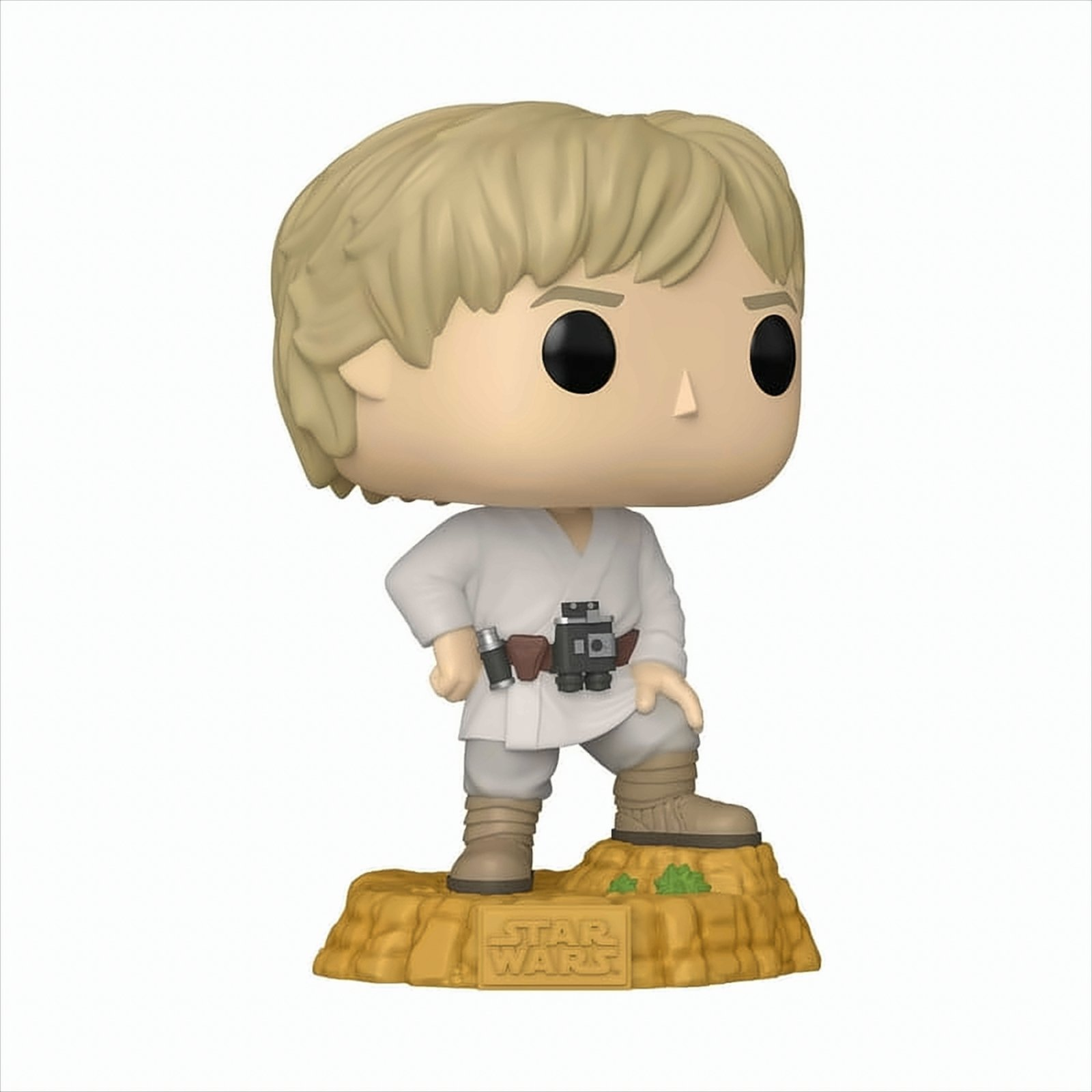 Figurka Funko Pop Luke'a Skywalkera w białym stroju stojącego na brązowej skalistej podstawie z logo Star Wars.