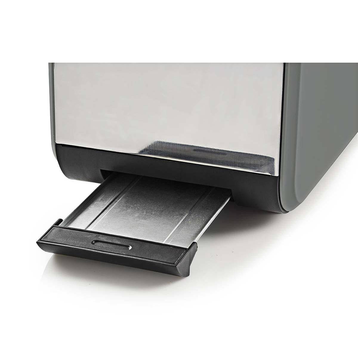 Zbliżenie na toster pokazujący wysuniętą szufladę na okruchy. Toster jest szary i czarny.