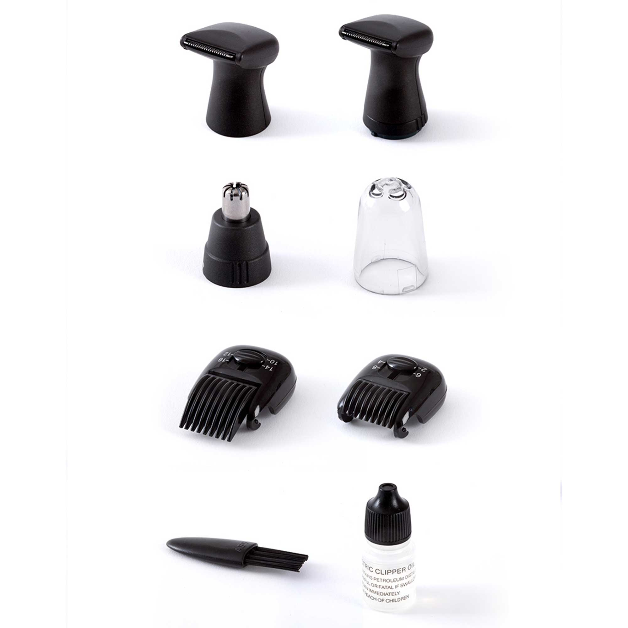 Various trimmer heads, brush, and oil bottle on a white surface.
