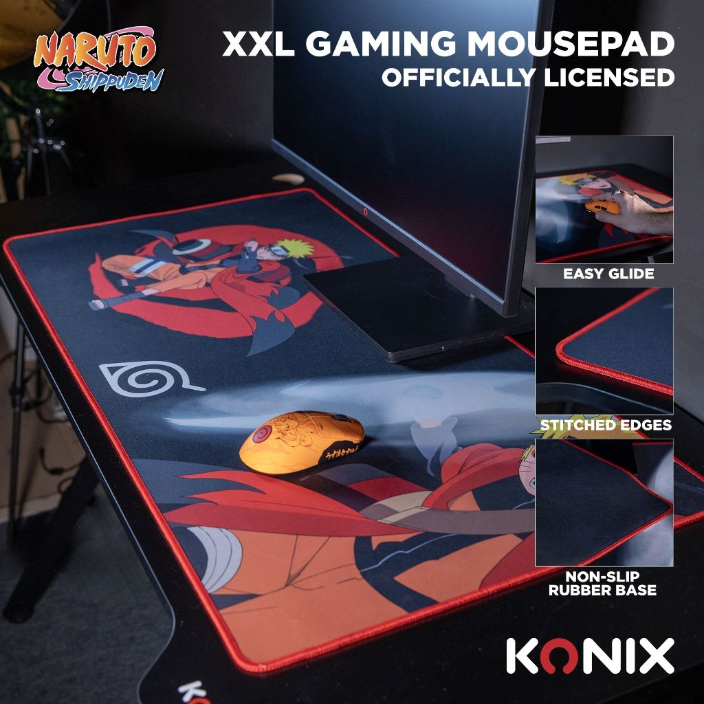 Un tapis de souris de jeu Naruto orange avec un bureau noir, un moniteur et une souris noire.